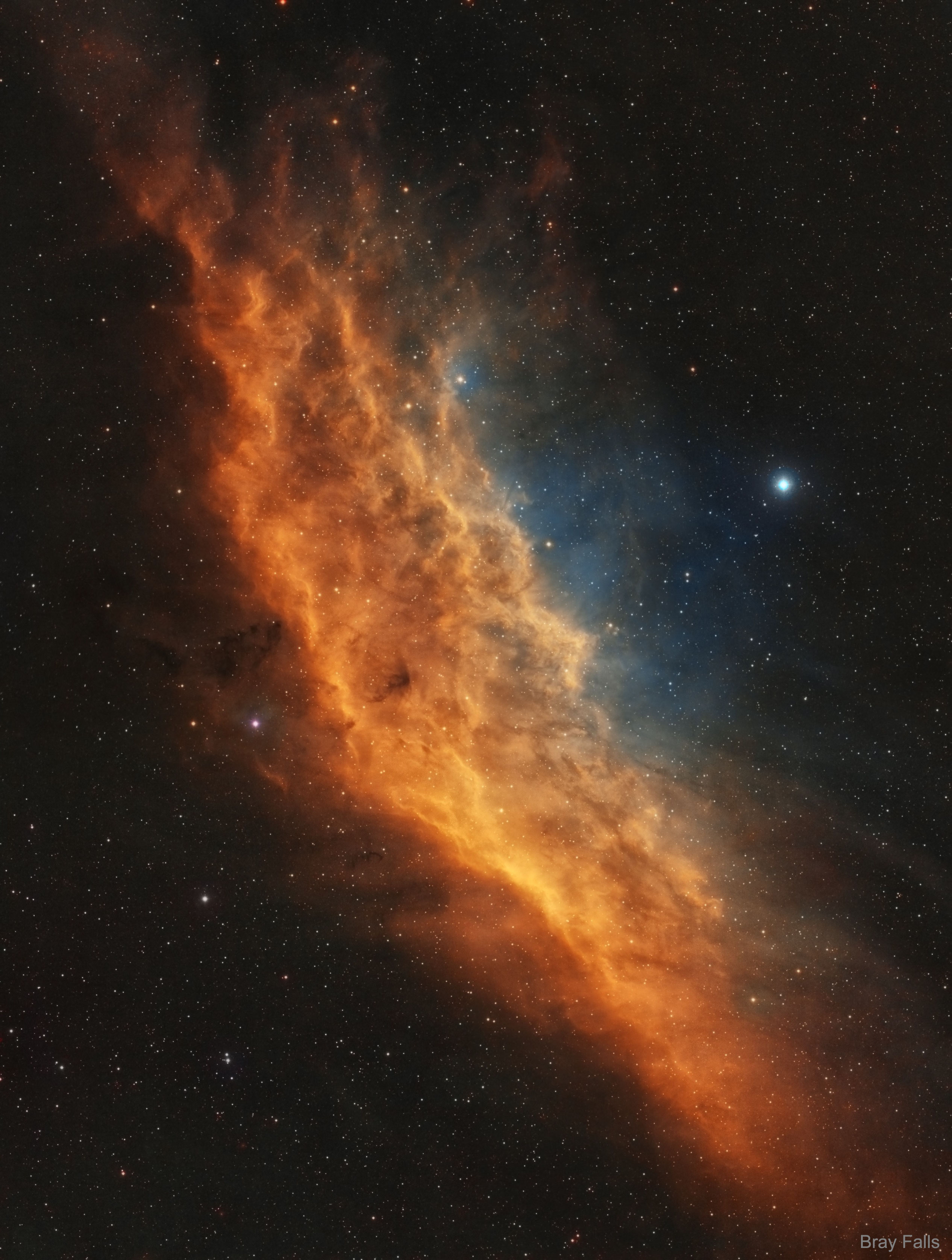 There's even a California in space.  Drifting through the Orion Arm of the spiral Milky Way Galaxy, this cosmic cloud by chance echoes the outline of California on the west coast of the United States. Our own Sun also lies within the Milky Way's Orion Arm, only about 1,500 light-years from the California Nebula. Also known as NGC 1499, the classic emission nebula is around 100 light-years long. On the featured image, the most prominent glow of the California Nebula is the red light characteristic of hydrogen atoms recombining with long lost electrons, stripped away (ionized) by energetic starlight. The star most likely providing the energetic starlight that ionizes much of the nebular gas is the bright, hot, bluish Xi Persei just to the right of the nebula.  A regular target for astrophotographers, the California Nebula can be spotted with a wide-field telescope under a dark sky toward the constellation of Perseus, not far from the Pleiades.