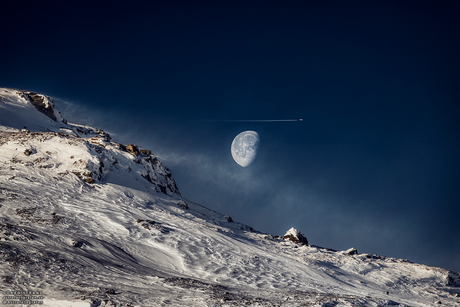 This is a gibbous Moon. More Earthlings are familiar with a full moon, when the entire face of Luna is lit by the Sun, and a crescent moon, when only a sliver of the Moon's face is lit.  When more than half of the Moon is illuminated, though, but still short of full illumination, the phase is called gibbous.  Rarely seen in television and movies, gibbous moons are quite common in the actual night sky. The featured image was taken in J�mtland, Sweden near the end of last month.  That gibbous moon turned, in a few days, into a crescent moon, and then a new moon, then back to a crescent, and a few days ago back to gibbous.  And this same gibbous moon is visible again tonight, leading up to the Full Beaver Moon that occurs Friday night.  Setting up to capture a picturesque gibbous moonscape, the photographer was quite surprised to find an airplane, surely well in the foreground, appearing to fly past it.