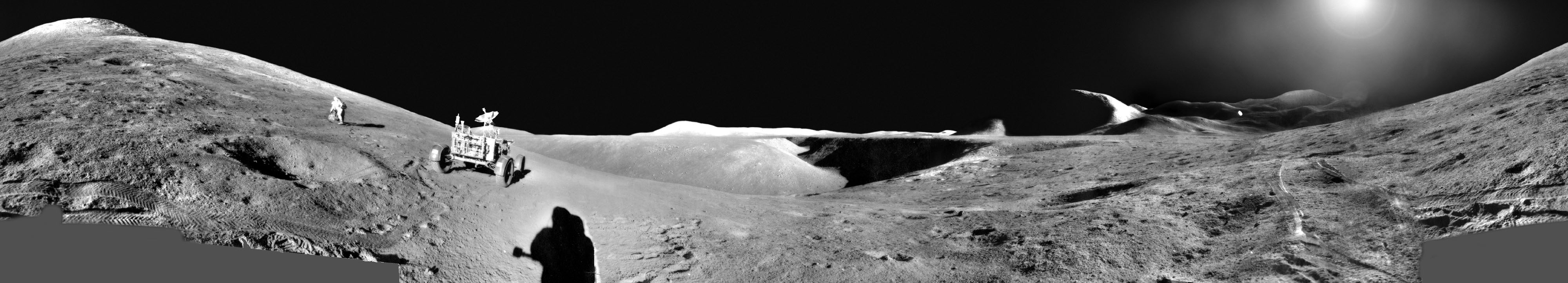 What would it be like to explore the Moon? NASA's Apollo missions gave humans just this chance in the late 1960s and early 1970s.  In particular, the Apollo 15 mission was dedicated to better understanding the surface of the Moon by exploring mountains, valleys, maria, and highlands. Astronauts David Scott and James Irwin spent nearly three days on the Moon while Alfred Worden orbited above in the Command Module.  The mission, which blasted off from Earth on 1971 July 26, was the first to deploy a Lunar Roving Vehicle.  Pictured in this digitally stitched mosaic panorama, David Scott, exploring his surroundings,  examines a boulder in front of the summit of Mt. Hadley Delta.  The shadow of James Irwin is visible to the right, while scrolling to the right will reveal a well-lit and diverse lunar terrain.  The Apollo 15 mission returned about 76 kilograms of moon rocks for detailed study.  In the future, NASA and other space agencies plan to continue to lead humanity's exploration of the Moon, Mars, and beyond.