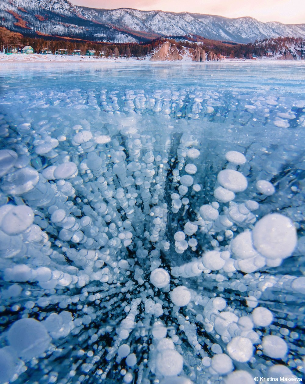 What are these bubbles frozen into Lake Baikal? Methane.  Lake Baikal, a UNESCO World Heritage Site in Russia, is the world's largest (by volume), oldest, and deepest lake, containing over 20% of the world's fresh water. The lake is also a vast storehouse of methane, a greenhouse gas that, if released, could potentially increase the amount of infrared light absorbed by Earth's atmosphere, and so increase the average temperature of the entire planet. Fortunately, the amount of methane currently bubbling out is not climatologically important. It is not clear what would happen, though, were temperatures to significantly increase in the region, or if the water level in Lake Baikal were to drop.  Pictured, bubbles of rising methane froze during winter into the exceptionally clear ice covering the lake.