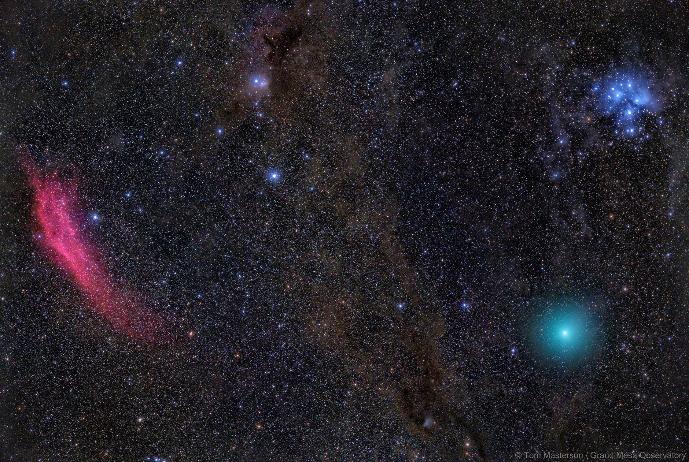 This festively colored skyscape was captured in the early morning hours of December 17, following Comet Wirtanen's closest approach to planet Earth. The comet was just visible to the eye. The lovely green color of its fluorescing cometary atmosphere or coma is brought out here only by adding digital exposures registered on the comet's position below the Pleiades star cluster. The exposures also bring out blue starlight reflected by the dust clouds surrounding the young Pleiades stars. Gaze (toward the left) across dusty dark nebulae along the edge of the Perseus molecular cloud and you'll travel to emission nebula NGC 1499, also known as the California nebula. Too faint for the eye, the cosmic cloud's pronounced reddish glow is from electrons recombining with ionized hydrogen atoms. Around December 23rd, Comet Wirtanen should be easy to find with binoculars when it sweeps close to bright star Capella in the northern winter constellation Auriga, the Charioteer.