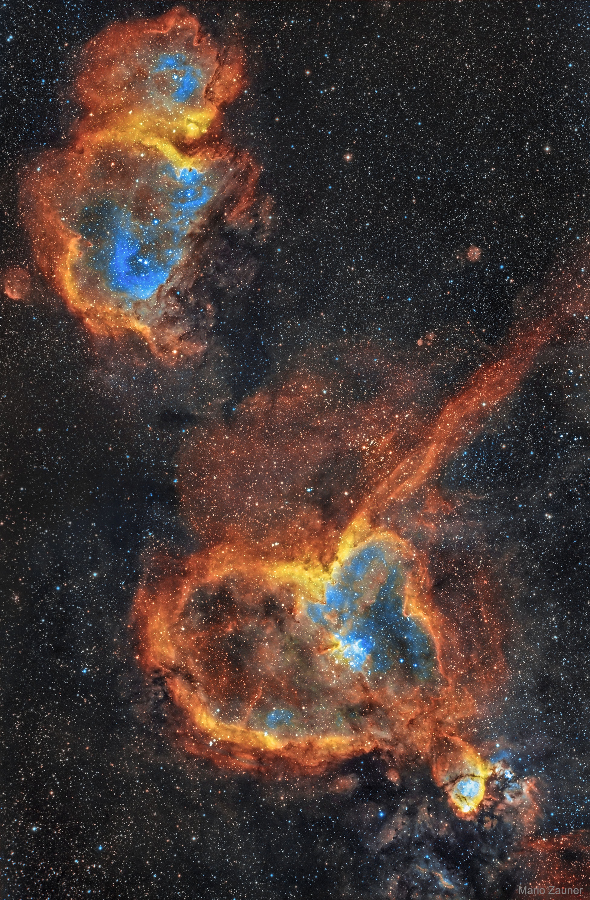 Is the heart and soul of our Galaxy located in Cassiopeia?  Possibly not, but that is where two bright emission nebulas nicknamed Heart and Soul can be found.  The Heart Nebula, officially dubbed IC 1805 and visible in the featured image on the bottom right, has a shape reminiscent of a classical heart symbol.  The Soul Nebula is officially designated IC 1871 and is visible on the upper left. Both nebulas shine brightly in the red light of energized hydrogen. Also shown in this three-color montage is light emitted from sulfur, shown in yellow, and oxygen, shown in blue.  Several young open clusters of stars are visible near the nebula centers.  Light takes about 6,000 years to reach us from these nebulas, which together span roughly 300 light years.  Studies of stars and clusters like those found in the Heart and Soul Nebulas have focused on how massive stars form and how they affect their environment.   Follow APOD on: Instagram, Facebook,  Reddit, or Twitter