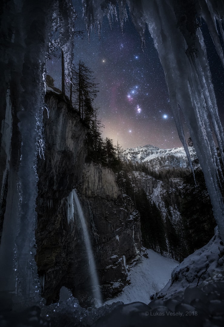 Do you recognize this constellation? Through the icicles and past the mountains is Orion, one of the most identifiable star groupings on the sky and an icon familiar to humanity for over 30,000 years. Orion has looked pretty much the same during the past 50,000 years and should continue to look the same for many thousands of years into the future.  Orion is quite prominent in the sky this time of year, a recurring sign of (modern) winter in Earth's northern hemisphere and summer in the south. Pictured, Orion was captured recently above the Austrian Alps in a composite of seven images taken by the same camera in the same location during the same night. Below and slightly to the right of Orion's three-star belt is the Orion Nebula, while the four bright stars surrounding the belt are, clockwise from the upper left, Betelgeuse, Bellatrix, Rigel, and Saiph.    New: Instagram page features cool images recently submitted to APOD