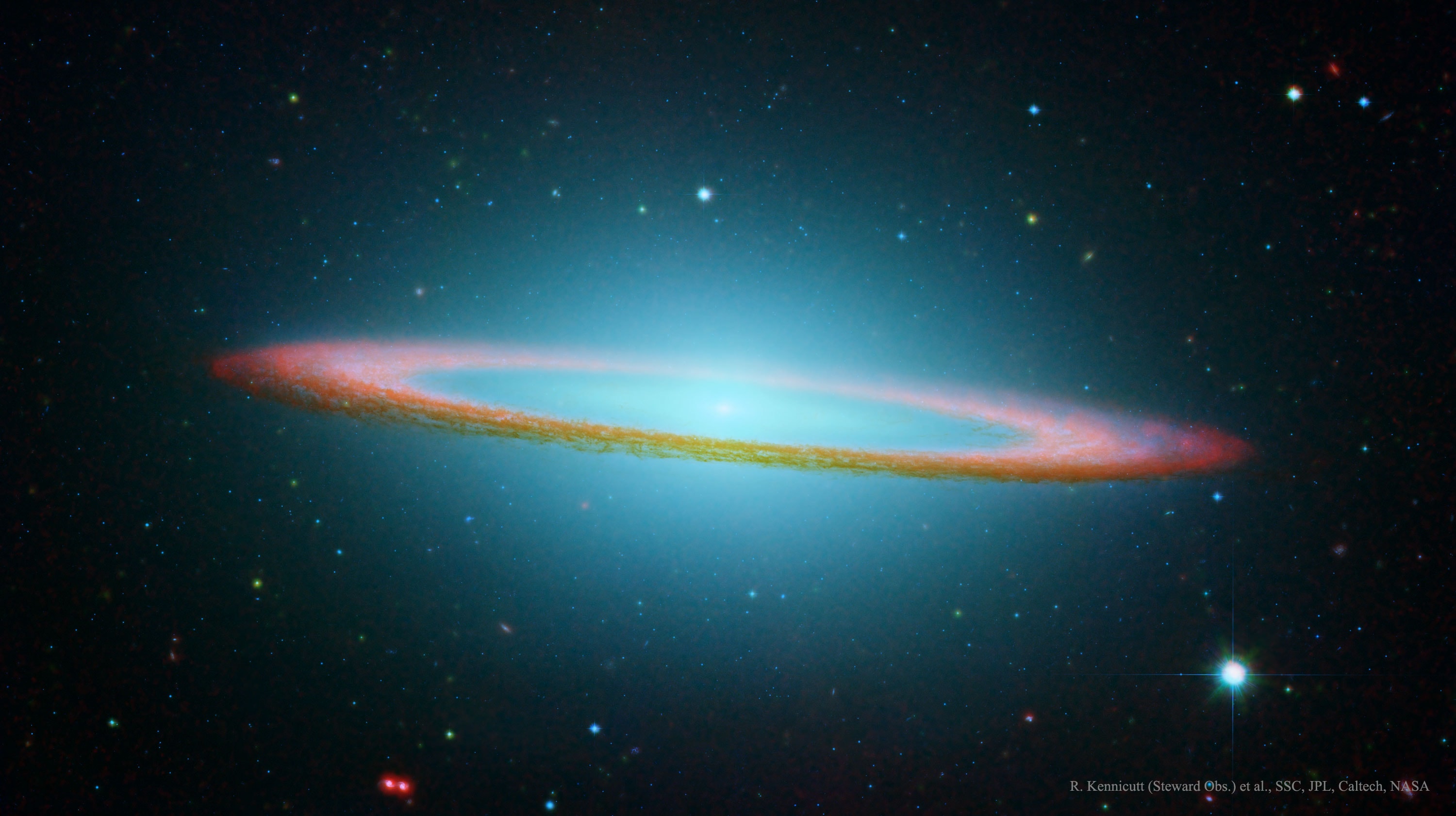 This floating ring is the size of a galaxy.  In fact, it is a galaxy -- or at least part of one: the photogenic Sombrero Galaxy, one of the largest galaxies in the nearby Virgo Cluster of Galaxies.  The dark band of dust that obscures the mid-section of the Sombrero Galaxy in optical light actually glows brightly in infrared light.  The featured image, digitally sharpened, shows the infrared glow, recently recorded by the orbiting Spitzer Space Telescope, superposed in false-color on an existing image taken by NASA's Hubble Space Telescope in optical light. The Sombrero Galaxy, also known as M104, spans about 50,000 light years across and lies 28 million light years away.  M104 can be seen with a small telescope in the direction of the constellation Virgo.   News: New Horizons Spacecraft Passes Ultima Thule