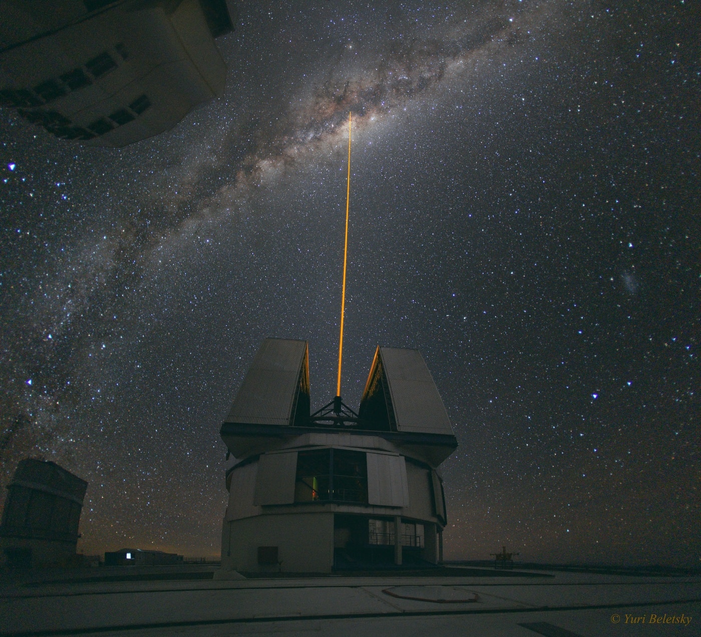 Why are these people shooting a powerful laser into the center of our Galaxy?  Fortunately, this is not meant to be the first step in a Galactic war.  Rather, astronomers at the Very Large Telescope (VLT) site in Chile are trying to measure the distortions of Earth's ever changing atmosphere.  Constant imaging of high-altitude atoms excited by the laser -- which appear like an artificial star -- allow astronomers to instantly measure atmospheric blurring.  This information is fed back to a VLT telescope mirror which is then slightly deformed to minimize this blurring.  In this case, a VLT was observing our Galaxy's center, and so Earth's atmospheric blurring in that direction was needed.  As for inter-galaxy warfare, when viewed from our Galaxy's center, no casualties are expected.  In fact, the light from this powerful laser would combine with light from our Sun to together appear only as bright as a faint and distant star.    APOD in other languages: Arabic, Catalan, Chinese (Beijing), Chinese (Taiwan), Croatian, Czech, Dutch, German, French, French, Hebrew, Indonesian, Japanese, Korean, Montenegrin, Polish, Russian, Serbian, Slovenian and Spanish