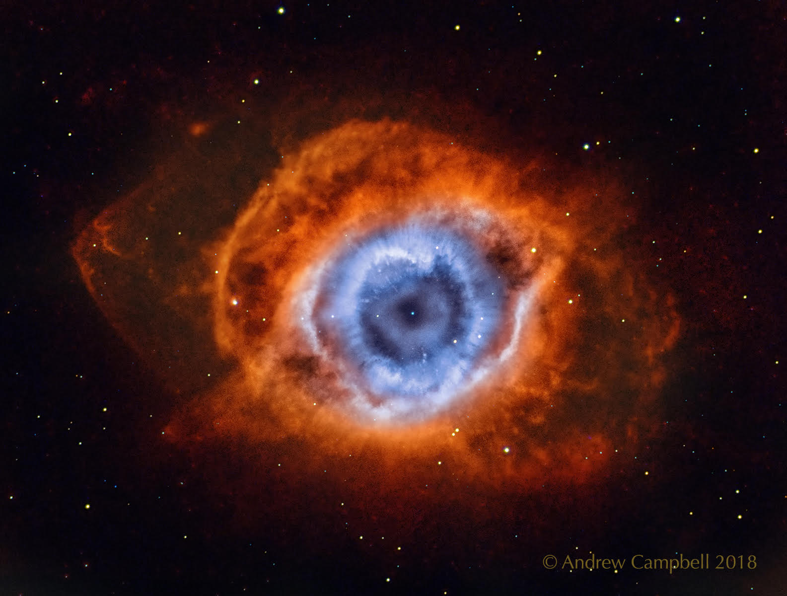 Is the Helix Nebula looking at you? No, not in any biological sense, but it does look quite like an eye. The Helix Nebula is so named because it also appears that you are looking down the axis of a helix. In actuality, it is now understood to have a surprisingly complex geometry, including radial filaments and extended outer loops.  The Helix Nebula (aka NGC 7293) is one of brightest and closest examples of a planetary nebula, a gas cloud created at the end of the life of a Sun-like star. The remnant central stellar core, destined to become a white dwarf star, glows in light so energetic it causes the previously expelled gas to fluoresce. The featured picture, taken in the light emitted by oxygen (shown in blue) and hydrogen (shown in red), was created from 74 hours of exposure over three months from a small telescope in a backyard of suburban Melbourne, Australia.  A close-up of the inner edge of the Helix Nebula shows complex gas knots of unknown origin.
