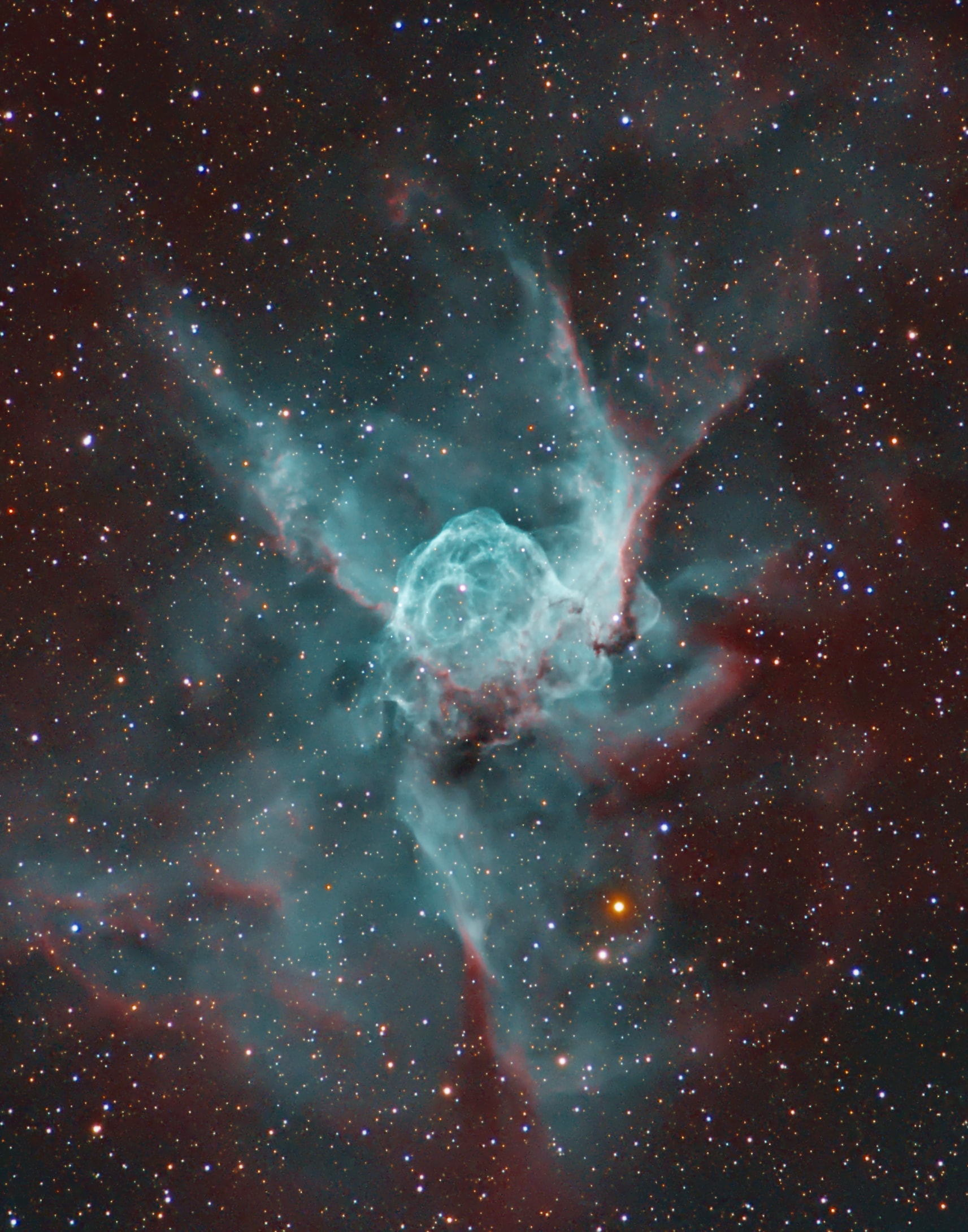 NGC 2359 is a helmet-shaped cosmic cloud with wing-like appendages popularly called Thor's Helmet. Heroically sized even for a Norse god, Thor's Helmet is about 30 light-years across. In fact, the helmet is more like an interstellar bubble, blown as a fast wind from the bright, massive star near the bubble's center inflates a region within the surrounding molecular cloud. Known as a Wolf-Rayet star, the central star is an extremely hot giant thought to be in a brief, pre-supernova stage of evolution. NGC 2359 is located about 15,000 light-years away in the constellation Canis Major. The remarkably detailed image is a mixed cocktail of data from broadband and narrowband filters that captures natural looking stars and the glow of the nebula's filamentary structures. It highlights a blue-green color from strong emission due to oxygen atoms in the glowing gas.
