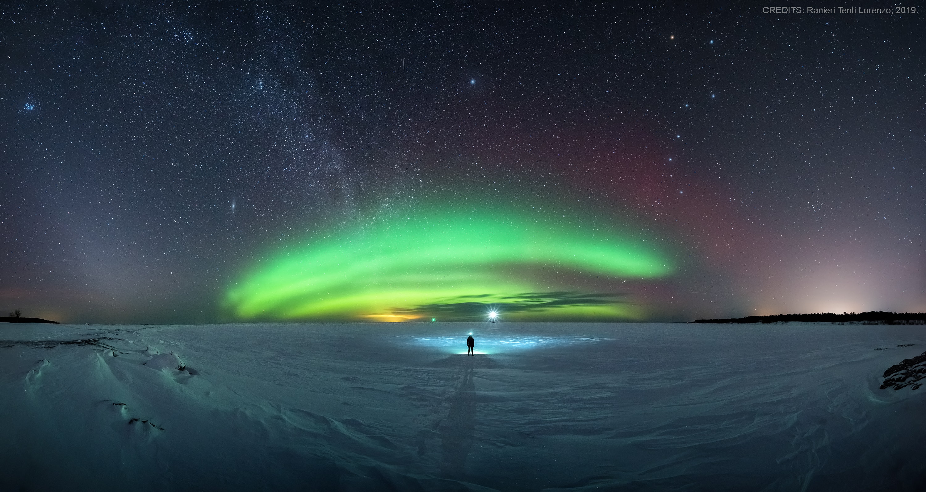 Despite the cold, a chance to view the shimmering northern lights coaxed this skygazer onto the frozen surface of Lake Superior on the west coast of the Keweenaw Peninsula and offered this nocturnal crescendo as a reward. A northern late winter night sky also plays across the panoramic composition of images made between 10pm and 1am on the night of February 28/March 1. At left, a faint band of Zodiacal light rises sharply from the horizon crossing Mars and the Pleides star cluster. Both the distant galaxy M31 and our own Milky Way shine above the greenish auroral arc. Navigational north pole star Polaris is centered above and accompanied on the right by the northern night's most recognizable asterism, the Big Dipper. Terrestrial lights include markers for two breakwaters on the the horizon near the center of the scene.