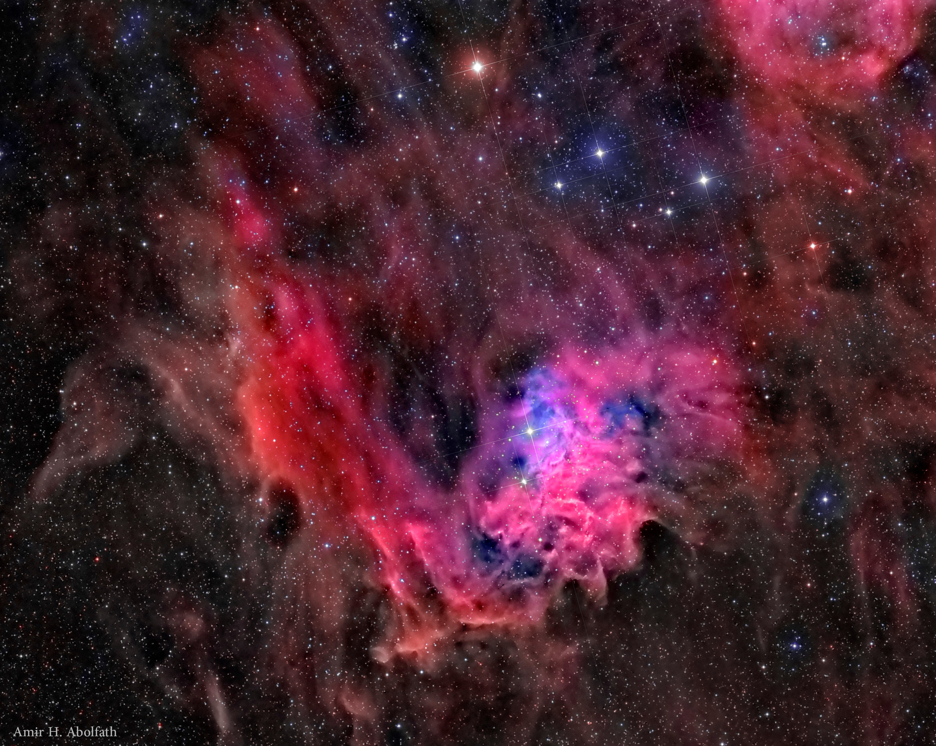 Is star AE Aurigae on fire? No.  Even though AE Aurigae is named the flaming star, the surrounding nebula IC 405 is named the Flaming Star Nebula, and the region shape gives the appearance of fire, there is no fire.  Fire, typically defined as the rapid molecular acquisition of oxygen, happens only when sufficient oxygen is present and is not important in such high-energy, low-oxygen environments such as stars.  The material that appears as smoke is mostly interstellar hydrogen, but does contain smoke-like dark filaments of carbon-rich dust grains. The bright star AE Aurigae, visible just to the lower right of the image center, is so hot it glows blue, emitting light so energetic it knocks electrons away from surrounding gas. When a proton recaptures an electron, light is emitted, as seen in the surrounding emission nebula.  Featured here, the Flaming Star nebula lies about 1,500 light years distant, spans about 5 light years, and is visible with a small telescope toward the constellation of the Charioteer (Auriga).   Follow APOD on: Instagram, Facebook,  Reddit, or Twitter