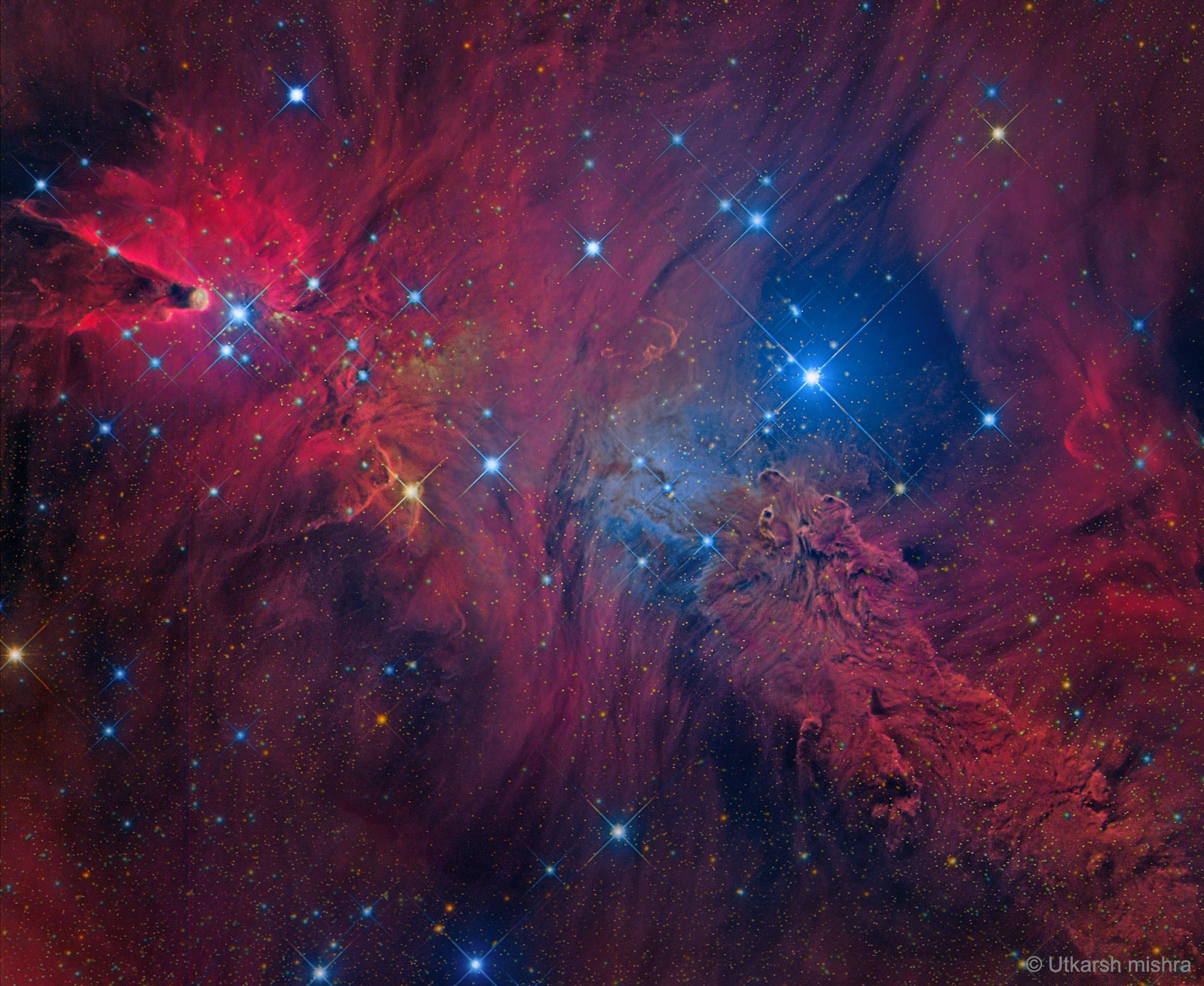 Strange shapes and textures can be found in neighborhood of the Cone Nebula. The unusual shapes originate from fine interstellar dust reacting in complex ways with the energetic light and hot gas being expelled by the young stars.  The brightest star on the right of the featured picture is S Mon, while the region just below it has been nicknamed the Fox Fur Nebula for its color and structure. The blue glow directly surrounding S Mon results from reflection, where neighboring dust reflects light from the bright star. The red glow that encompasses the whole region results not only from dust reflection but also emission from hydrogen gas ionized by starlight. S Mon is part of a young open cluster of stars named NGC 2264, located about 2500 light years away toward the constellation of the Unicorn (Monoceros).   Even though it points right at S Mon, details of the origin of the mysterious geometric Cone Nebula, visible on the far left, remain a mystery.