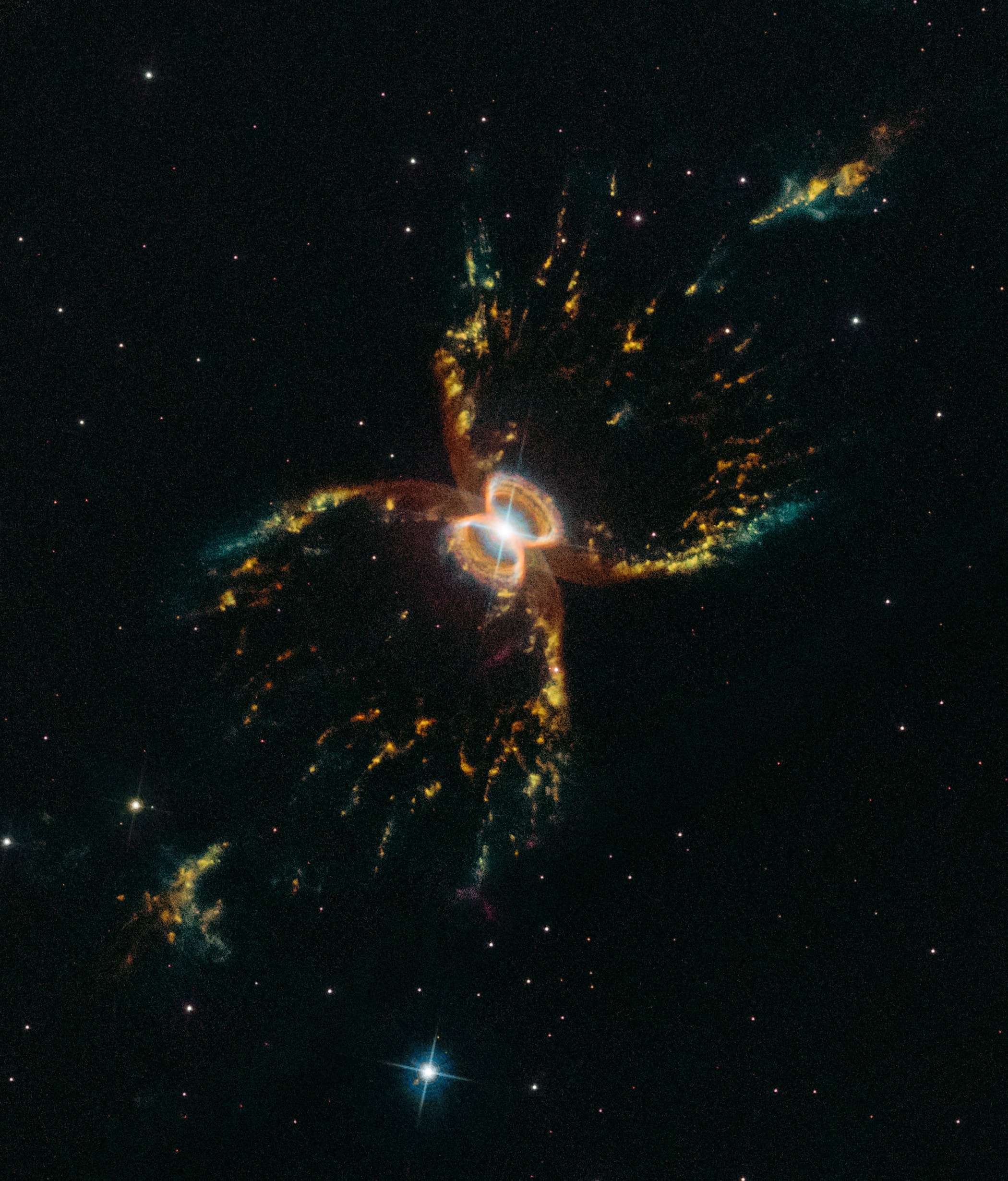 The symmetric, multi-legged appearance of the Southern Crab Nebula is certainly distinctive. About 7,000 light-years distant toward the southern sky constellation Centaurus, its glowing nested hourglass shapes are produced by the remarkable symbiotic binary star system at its center. The nebula's dramatic stellar duo consists of a hot white dwarf star and cool, pulsating red giant star shedding outer layers that fall onto the smaller, much hotter companion. Embedded in a disk of material, outbursts from the white dwarf cause an outflow of gas driven away both above and below the disk resulting in the bipolar hourglass shapes. The bright central shape is about half a light-year across. This new Hubble Space Telescope image celebrates the 29th anniversary of Hubble's launch on April 24, 1990 on board the Space Shuttle Discovery.