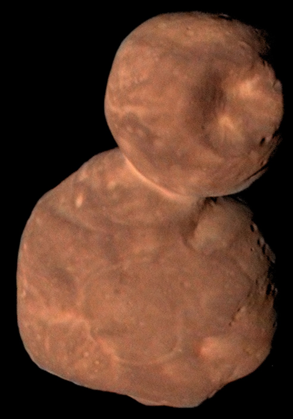Primordial contact binary 2014 MU69, also known as Ultima Thule, really is very red. In fact, it's the reddest outer solar system object ever visited by a spacecraft from Earth. Its reddish hue is believed to be due to organic materials on its surface. Ruddy color and tantalizing surface details seen in this composite image are based on data from the New Horizons spacecraft recorded during the January 1 flyby of the farthest world yet explored. Embedded in the smaller lobe Thule (top), the 8 kilometer wide feature nicknamed Maryland crater is the largest depression known on the surface of Ultima Thule. Transmission of data collected from the flyby continues, and will go on until the late summer 2020 as New Horizons speeds deeper into the dim and distant Kuiper Belt.