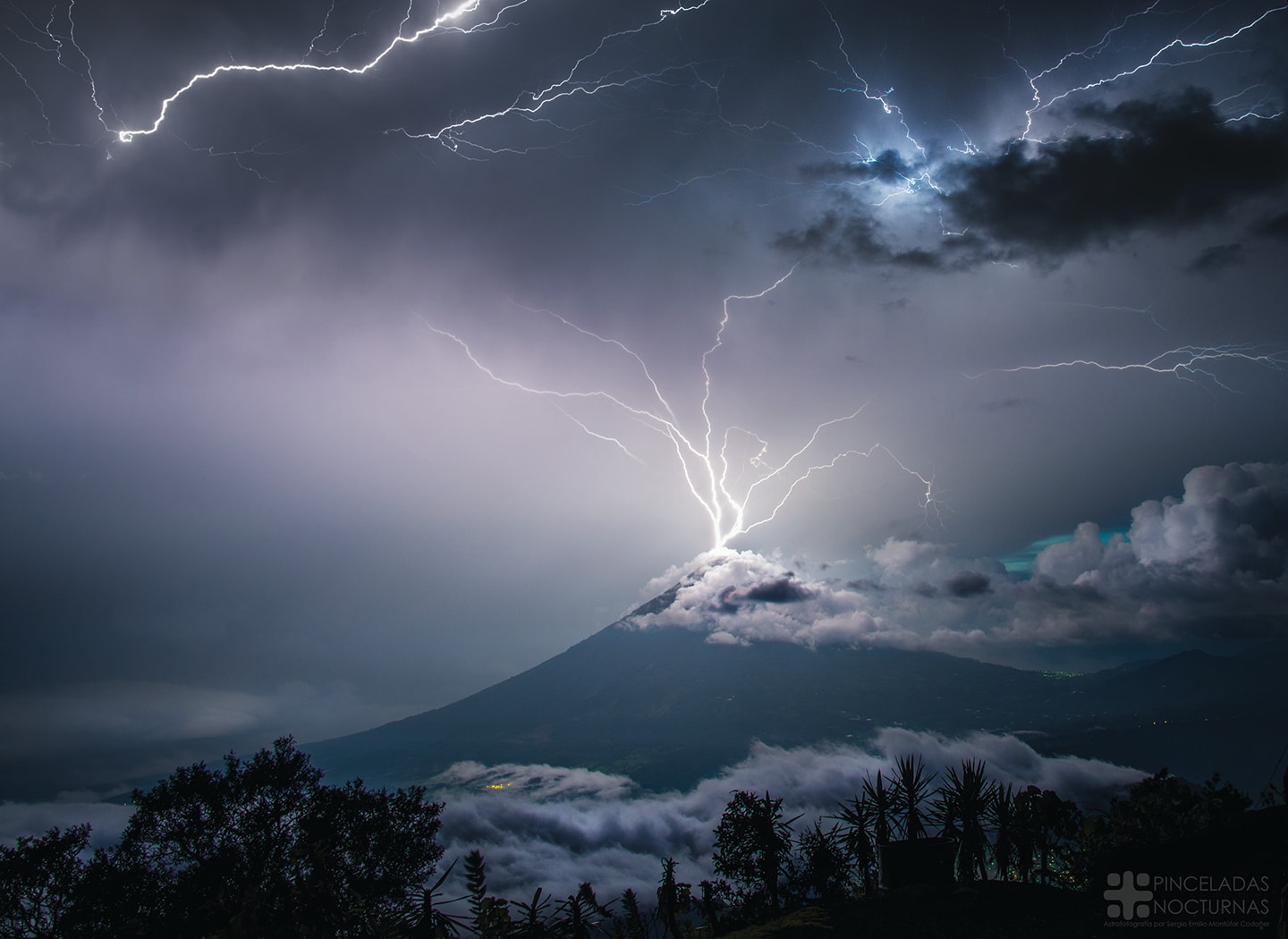 Have you ever watched a lightning storm in awe?  Join the crowd. Details of what causes lightning are still being researched, but it is known that inside some clouds, internal updrafts cause collisions between ice and snow that slowly separate charges between cloud tops and bottoms  The rapid electrical discharges that are lightning soon result.  Lightning usually takes a jagged course, rapidly heating a thin column of air to about three times the surface temperature of the Sun.  The resulting shock wave starts supersonically and decays into the loud sound known as thunder.  On average, around the world, about 6,000 lightning bolts occur between clouds and the Earth every minute. Pictured earlier this month in a two-image composite, lightning stems from communication antennas near the top of Volc�n de Agua (Volcano of Water) in Guatemala.