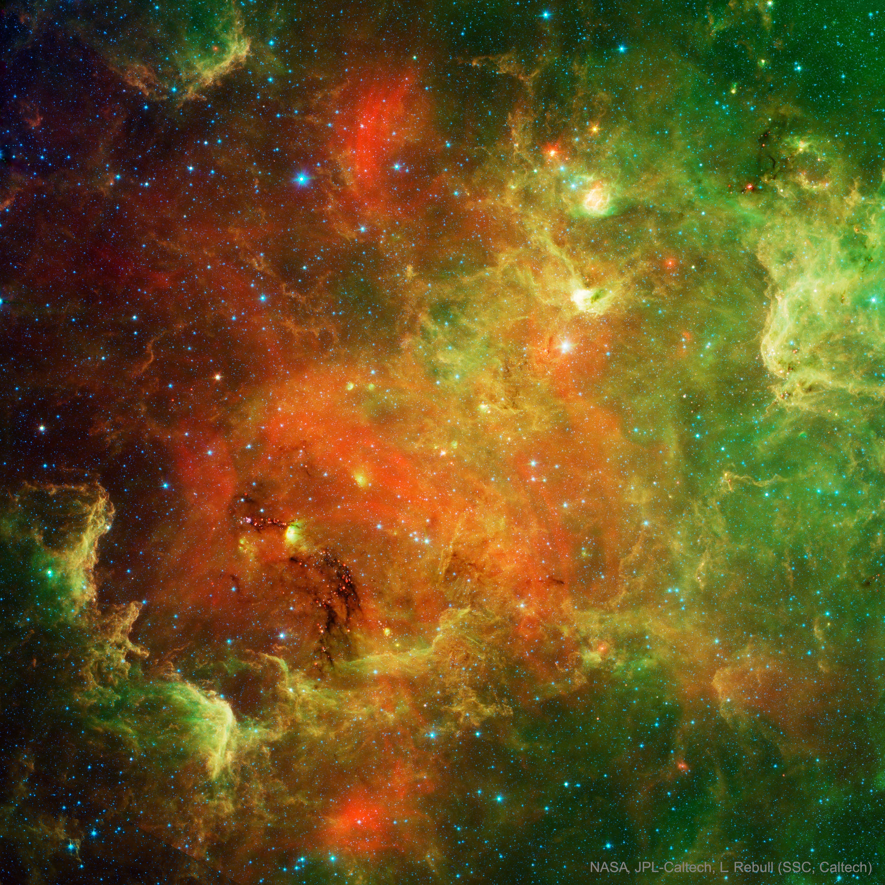 The North America Nebula can do what most North Americans cannot -- form stars.  Precisely where in the nebula these stars are forming has been mostly obscured by some of the nebula's thick dust that is opaque to visible light. However, a view of the North America Nebula in infrared light by the orbiting Spitzer Space Telescope has peered through much of the dust and uncovered thousands of newly formed stars. Rolling your cursor over the above scientifically-colored infrared image will bring up a corresponding optical image of the same region for comparison.  The infrared image neatly captures young stars in many stages of formation, from being imbedded in dense knots of gas and dust, to being surrounded by disks and emitted jets, to being clear of their birth cocoons. The North America Nebula (NGC 7000) spans about 50 light years and lies about 1,500 light years away toward the constellation of the Swan (Cygnus). Still, of all the stars known in the North America Nebula, which massive stars emit the energetic light that gives the ionized  red glow is still debated.
