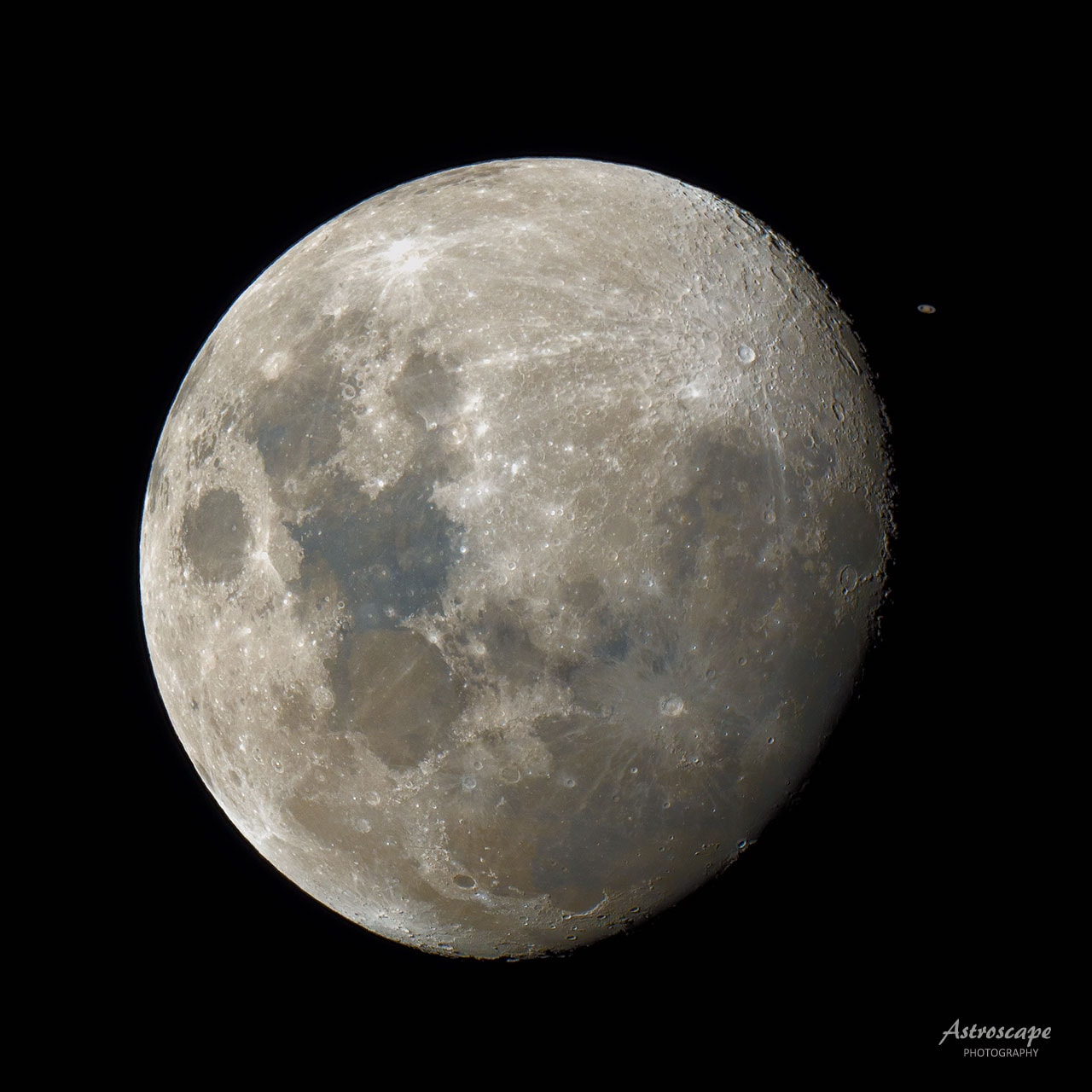 What's that next to the Moon? Saturn. In its monthly trip around the Earth -- and hence Earth's sky -- our Moon passed nearly in front of Sun-orbiting Saturn earlier this week.  Actually the Moon passed directly in front of Saturn from the viewpoints of a wide swath of Earth's Southern Hemisphere.  The featured image from Sydney, Australia captured the pair a few minutes before the eclipse.  The image was a single shot lasting only 1/500th of a second, later processed to better highlight both the Moon and Saturn. Since Saturn is nearly opposite the Sun, it can be seen nearly the entire night, starting at sunset, toward the south and east.  The gibbous Moon was also nearly opposite the Sun, and so also visible nearly the entire night -- it will be full tomorrow night. The Moon will occult Saturn again during every lap it makes around the Earth this year.