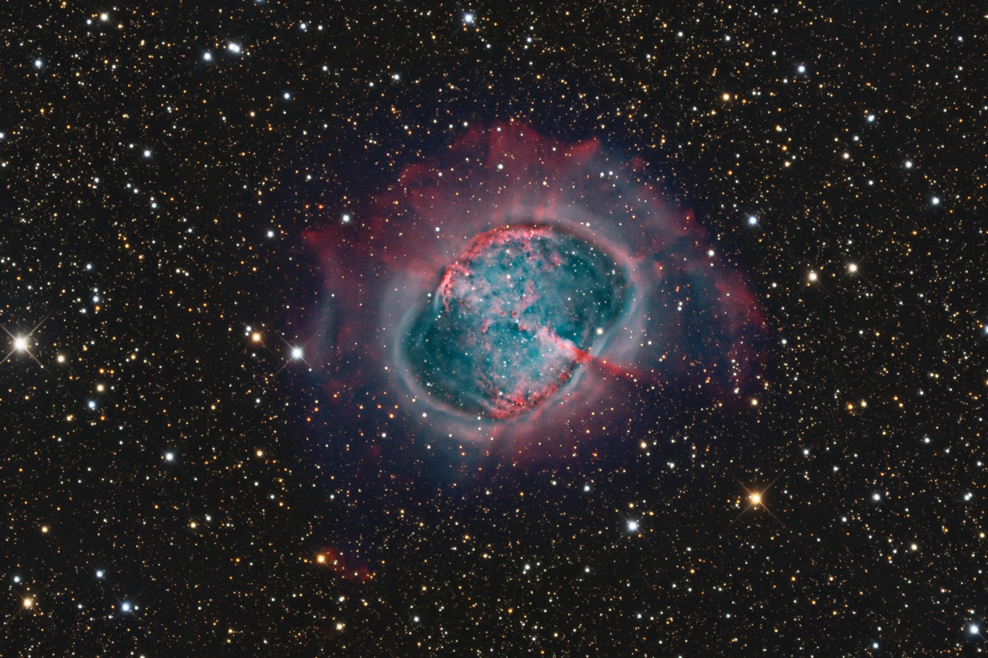 While hunting for comets in the skies above 18th century France, astronomer Charles Messier diligently kept a list of the things he encountered that were definitely not comets. This is number 27 on his now famous not-a-comet list. In fact, 21st century astronomers would identify it as a planetary nebula, but it's not a planet either, even though it may appear round and planet-like in a small telescope. Messier 27 (M27) is an excellent example of a gaseous emission nebula created as a sun-like star runs out of nuclear fuel in its core. The nebula forms as the star's outer layers are expelled into space, with a visible glow generated by atoms excited by the dying star's intense but invisible ultraviolet light. Known by the popular name of the Dumbbell Nebula, the beautifully symmetric interstellar gas cloud is over 2.5 light-years across and about 1,200 light-years away in the constellation Vulpecula. This impressive color composite highlights details within the well-studied central region and fainter, seldom imaged features in the nebula's outer halo. It incorporates broad and narrowband images recorded using filters sensitive to emission from hydrogen and oxygen atoms.