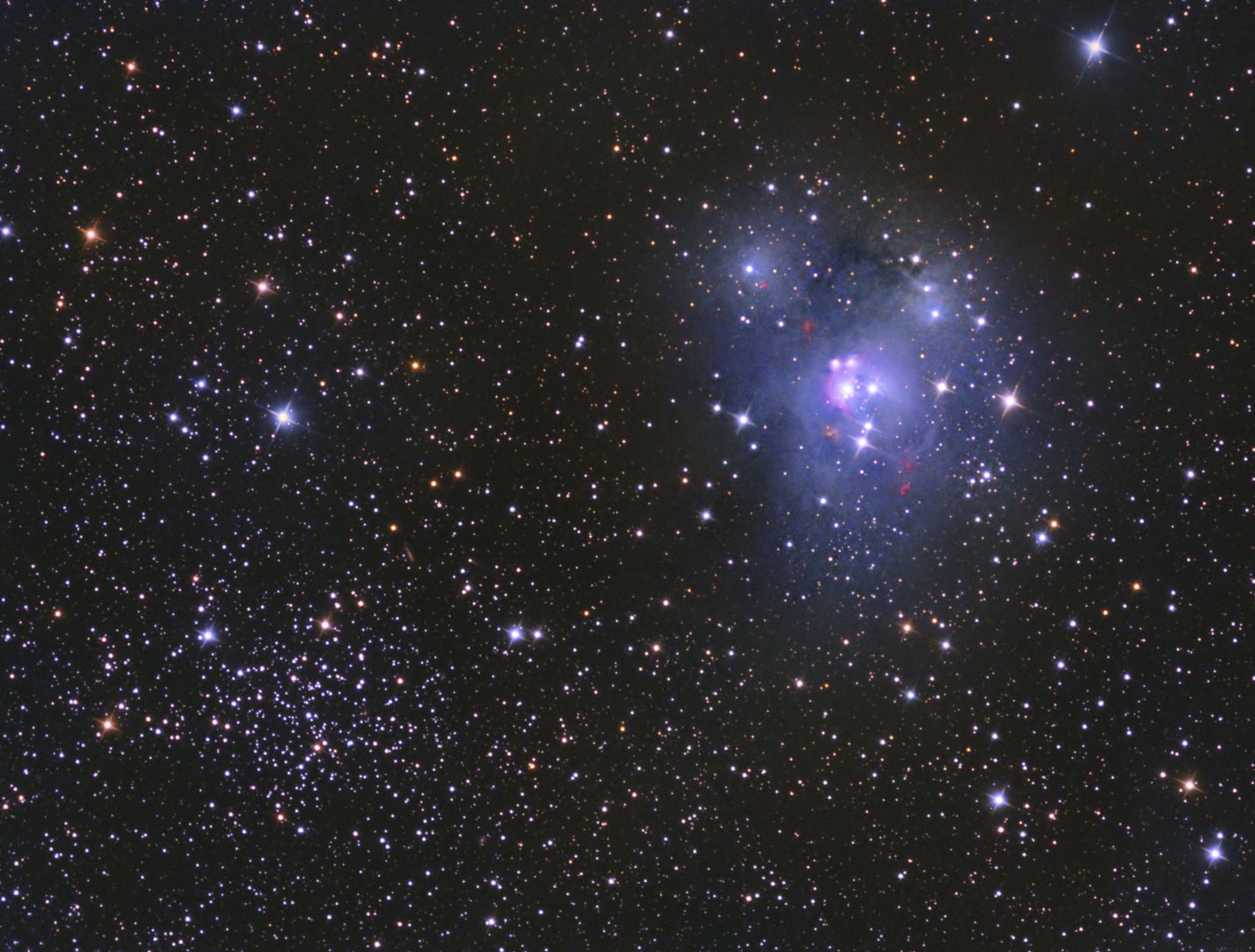 This wide-field telescopic image looks toward the constellation Cepheus and an intriguing visual pairing of dusty reflection nebula NGC 7129 (right) and open star cluster NGC 7142. The two appear separated by only half a degree on the sky, but they actually lie at quite different distances. In the foreground, dusty nebula NGC 7129 is about 3,000 light-years distant, while open cluster NGC 7142 is likely over 6,000 light-years away. In fact, pervasive and clumpy foreground dust clouds in this region redden the light from NGC 7142, complicating astronomical explorations of the cluster. Still, NGC 7142 is thought to be an older open star cluster, while the bright stars embedded in NGC 7129 are perhaps a few million years young. The telltale reddish crescent shapes around NGC 7129 are associated with energetic jets streaming away from newborn stars.