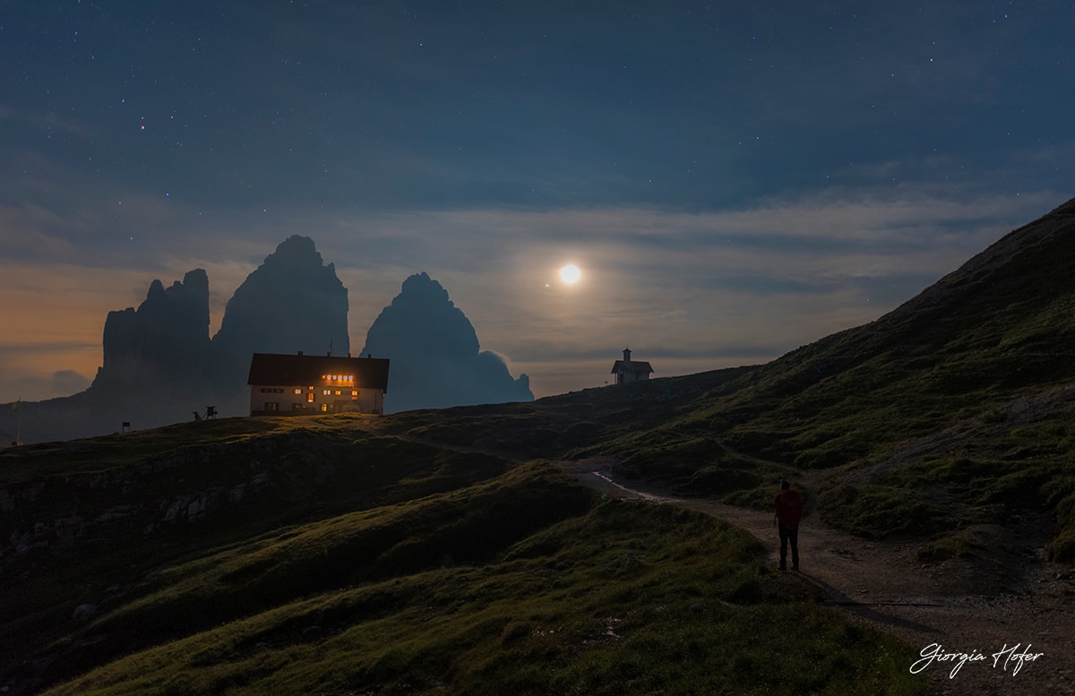 What are those bright lights in the sky ahead?  When hiking a high mountain pass in northern Italy three weeks ago, a conjunction between our Moon and the distant planet Jupiter was visible toward the south just after sunset. The picturesque mountains in the distance are Tre Cime di Lavaredo (Three Peaks of Lavaredo), a UNESCO World Heritage Site and three of the best known mountain peaks in Italy, the Dolomites, and the entire Alps. In the foreground on the left is Locatelli Hut, a refuge for tired hikers as it is located over an hour from nearest parking lot. The bright sky object on the upper left is Saturn.  The entire scene was captured on a single 8-second exposure.  Jupiter and Saturn will remain prominent in the southwestern sky after sunset this month, while the Moon, in its monthly orbit around the Earth, will pass near Jupiter again in about four days.