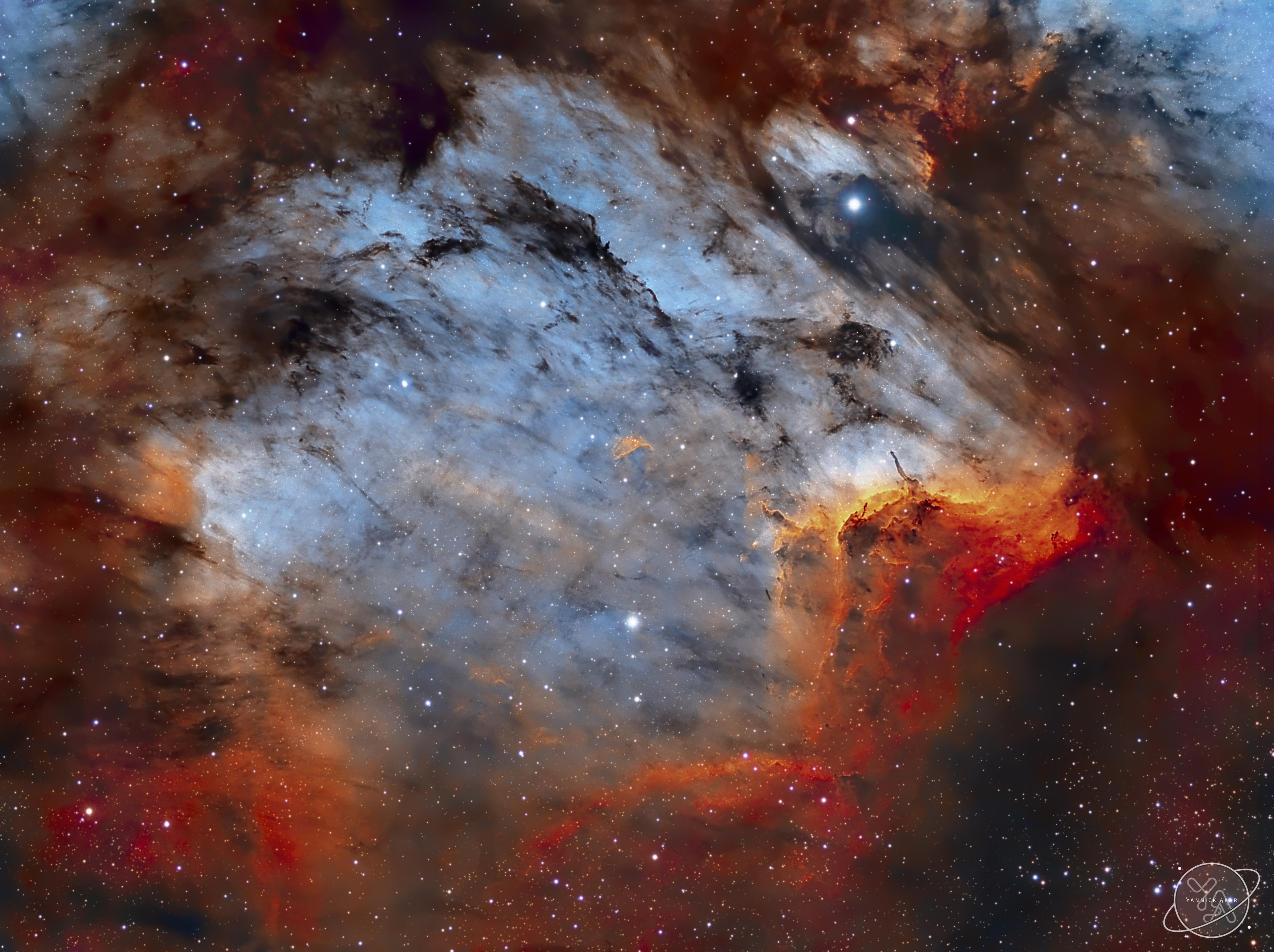 The Pelican Nebula is slowly being transformed.  IC 5070, the official designation, is divided from the larger North America Nebula by a molecular cloud filled with dark dust.  The Pelican, however, receives much study because it is a particularly active mix of star formation and evolving gas clouds.  The featured picture was produced in three specific colors -- light emitted by sulfur, hydrogen, and oxygen --  that can help us to better understand these interactions.  The light from young energetic stars is slowly transforming the cold gas to hot gas, with the advancing boundary between the two, known as an ionization front, visible in bright orange on the right. Particularly dense tentacles of cold gas remain.  Millions of years from now this nebula might no longer be known as the Pelican, as the balance and placement of stars and gas will surely leave something that appears completely different.