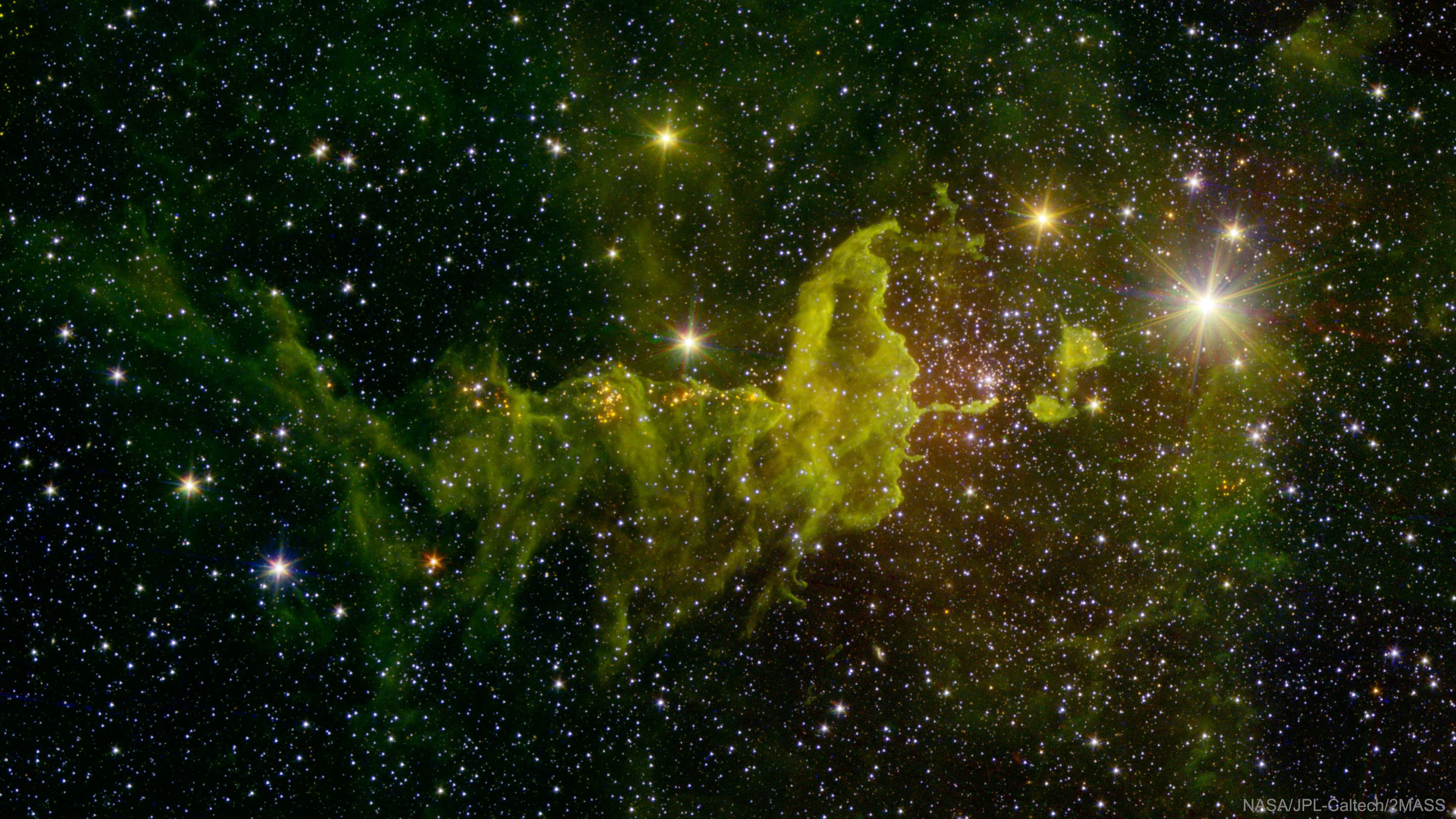 Will the spider ever catch the fly? Not if both are large emission nebulas toward the constellation of the Charioteer (Auriga).  The spider-shaped gas cloud on the left is actually an emission nebula labelled IC 417, while a smaller fly-shaped cloud off the image to the left is dubbed  NGC 1931 and is both an emission nebula and a reflection nebula.  About 10,000 light-years distant, both nebulas harbor young, open star clusters. For scale, the more compact NGC 1931 (Fly) is about 10 light-years across. The featured picture in scientifically-assigned, infrared colors combines images from the Spitzer Space Telescope and the Two Micron All Sky Survey (2MASS).  Spitzer is celebrating its 16th year orbiting the Sun near the Earth.    APOD in other languages: Arabic, Catalan, Chinese (Beijing), Chinese (Taiwan), Croatian, Czech, Dutch, Farsi, French, French, German, Hebrew, Indonesian, Japanese, Korean, Montenegrin, Polish, Russian, Serbian, Slovenian,  Spanish and Ukrainian