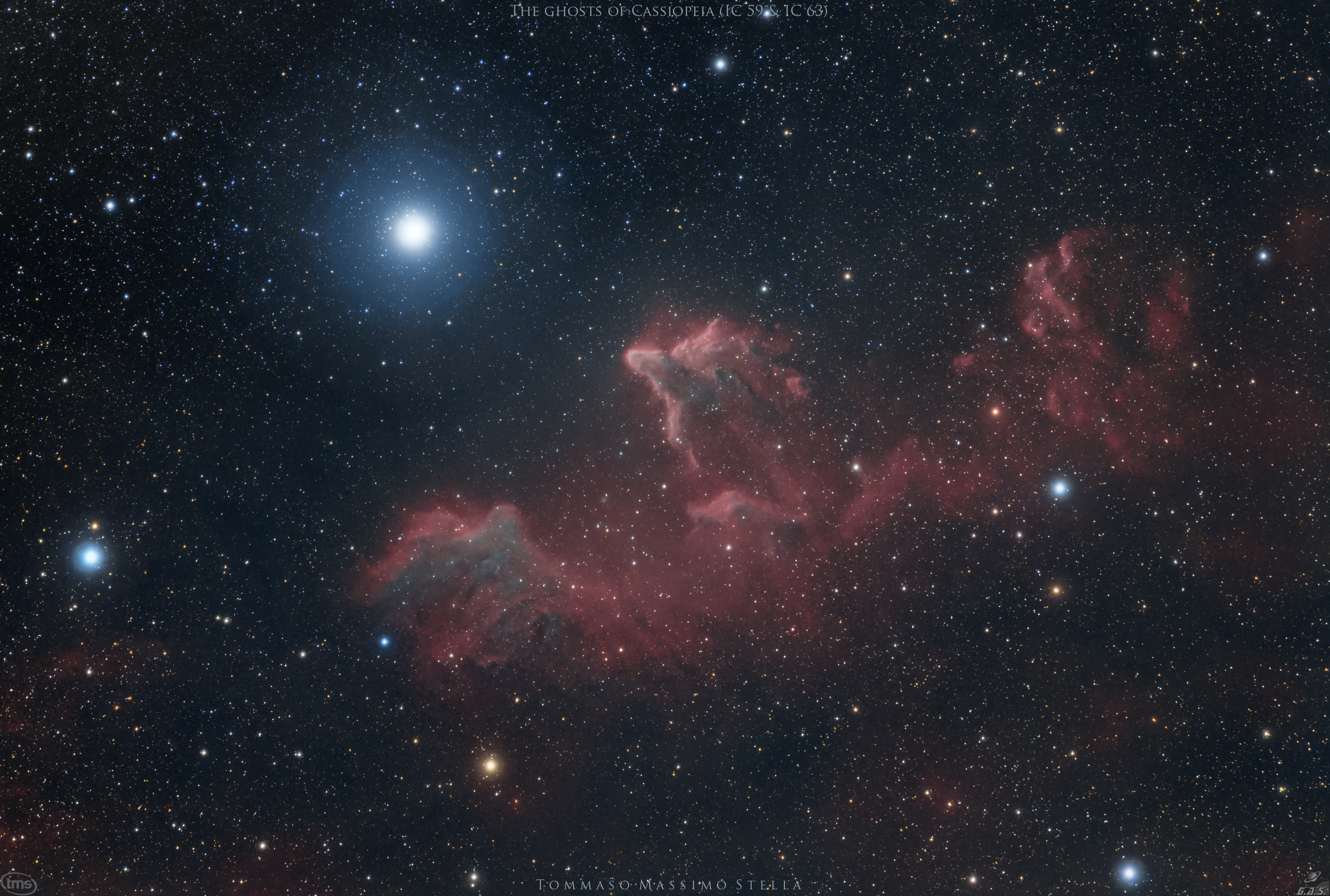 These bright rims and flowing shapes look ghostly on a cosmic scale. A telescopic view toward the constellation Cassiopeia, the colorful skyscape features swept-back, comet-shaped clouds IC 59 (left) and IC 63. About 600 light-years distant, the clouds aren't actually ghosts. They are slowly disappearing though, under the influence of energetic radiation from hot,luminous star gamma Cas. Gamma Cas is physically located only 3 to 4 light-years from the nebulae, the bright star just above and left in the frame. Slightly closer to gamma Cas, IC 63 is dominated by red H-alpha light emitted as hydrogen atoms ionized by the star's ultraviolet radiation recombine with electrons. Farther from the star, IC 59 shows proportionally less H-alpha emission but more of the characteristic blue tint of dust reflected star light. The field of view spans over 1 degree or 10 light-years at the estimated distance of gamma Cas and friends.