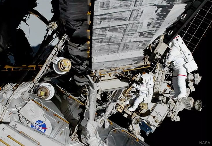The failed unit was beyond the reach of the robotic Canadarm2.  Therefore, this repair of the International Space Station would require humans. The humans on duty were NASA's Jessica Meir and Christina Koch. This was the fourth spacewalk for Koch, the first for Meir, and the first all-female spacewalk in human history.  The first woman to walk in space was Svetlana Savitskaya in 1984.  Koch (red stripe) and Meir are pictured hard at work on the P6 Truss, with solar panels and the darkness of space in the background.  Working over seven hours, the newly installed Battery Charge / Discharge Unit (BCDU) was successfully replaced and, when powered up, operated normally.
