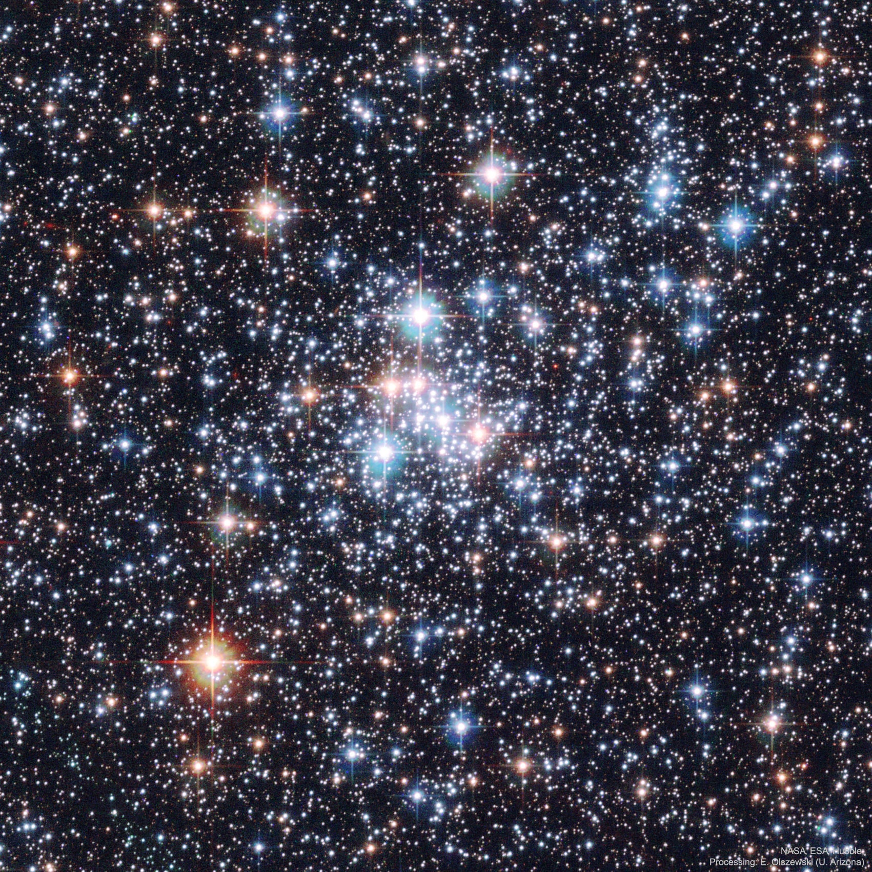 Jewels don't shine this bright -- only stars do.  Like gems in a jewel box, though, the stars of open cluster NGC 290 glitter in a beautiful display of brightness and color.   The photogenic cluster, pictured here, was captured in 2006 by the orbiting Hubble Space Telescope.  Open clusters of stars are younger, contain few stars, and contain a much higher fraction of blue stars than do globular clusters of stars.  NGC 290 lies about 200,000  light-years distant in a neighboring galaxy called the Small Cloud of Magellan (SMC).   The open cluster contains hundreds of stars and spans about 65 light years across.  NGC 290 and other open clusters are good laboratories for studying how stars of different masses evolve, since all the open cluster's stars were born at about the same time.