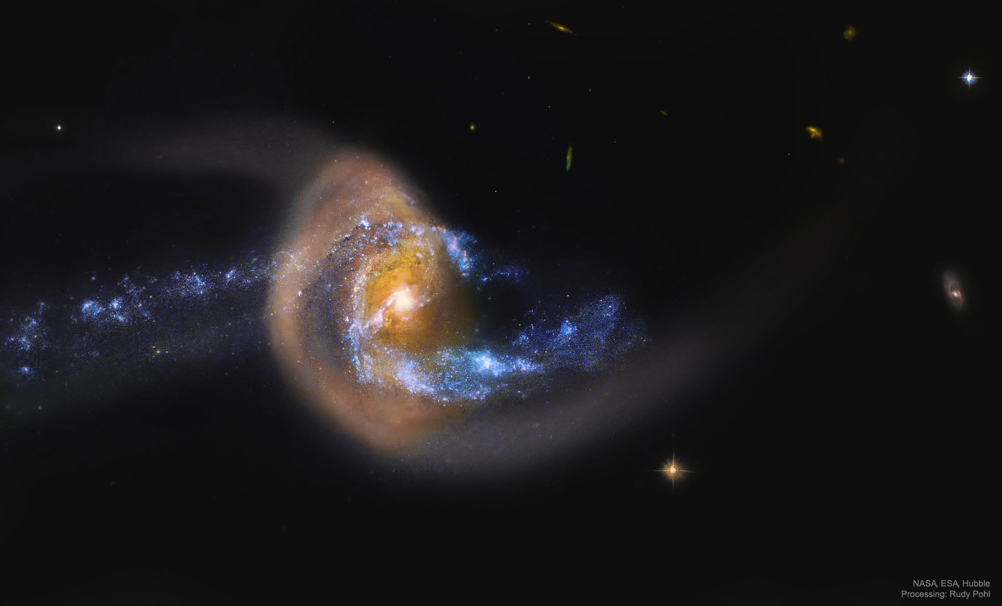 Is this galaxy jumping through a giant ring of stars?  Probably not.  Although the precise dynamics behind the featured image is yet unclear, what is clear is that the pictured galaxy, NGC 7714, has been stretched and distorted by a recent collision with a neighboring galaxy. This smaller neighbor, NGC 7715, situated off to the left of the featured frame, is thought to have charged right through NGC 7714. Observations indicate that the golden ring pictured is composed of millions of older Sun-like stars that are likely co-moving with the interior bluer stars. In contrast, the bright center of NGC 7714 appears to be undergoing a burst of new star formation.  The featured image was captured by the  Hubble Space Telescope.  NGC 7714 is located about 130 million light years away toward the constellation of the Two Fish (Pisces).  The interactions between these galaxies likely started about 150 million years ago and should continue for several hundred million years more, after which a single central galaxy may result.