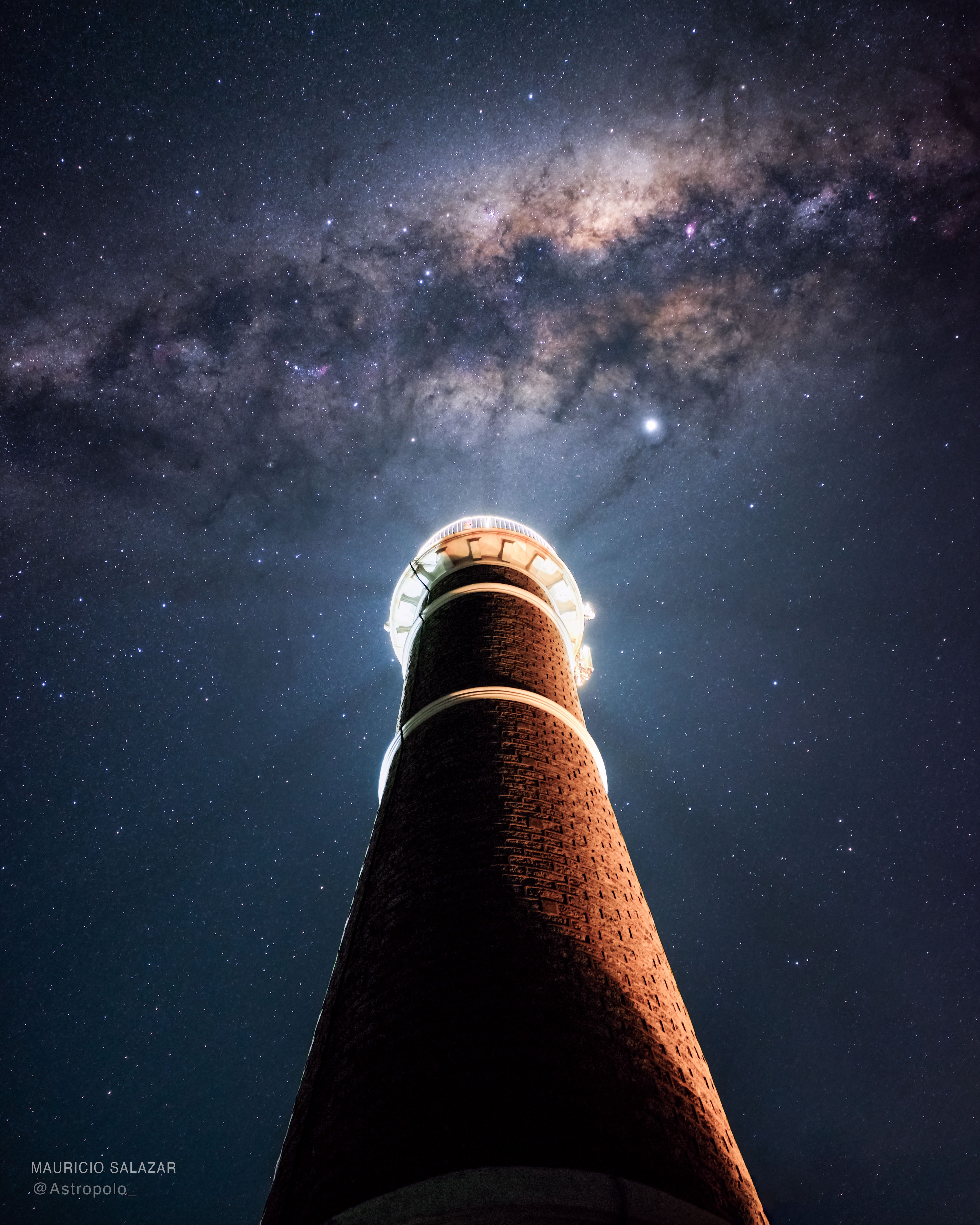 Can a lighthouse illuminate a galaxy? No, but in the featured image, gaps in light emanating from the Jose Ignacio Lighthouse in Uruguay appear to match up nicely, although only momentarily and coincidently, with dark dust lanes of our Milky Way Galaxy. The bright dot on the right is the planet Jupiter.  The central band of the Milky Way Galaxy is actually the central spiral disk seen from within the disk. The Milky Way band is not easily visible through city lights but can be quite spectacular to see in dark skies.  The featured picture is actually the addition of ten consecutive images taken by the same camera from the same location.  The images were well planned to exclude direct light from the famous lighthouse.