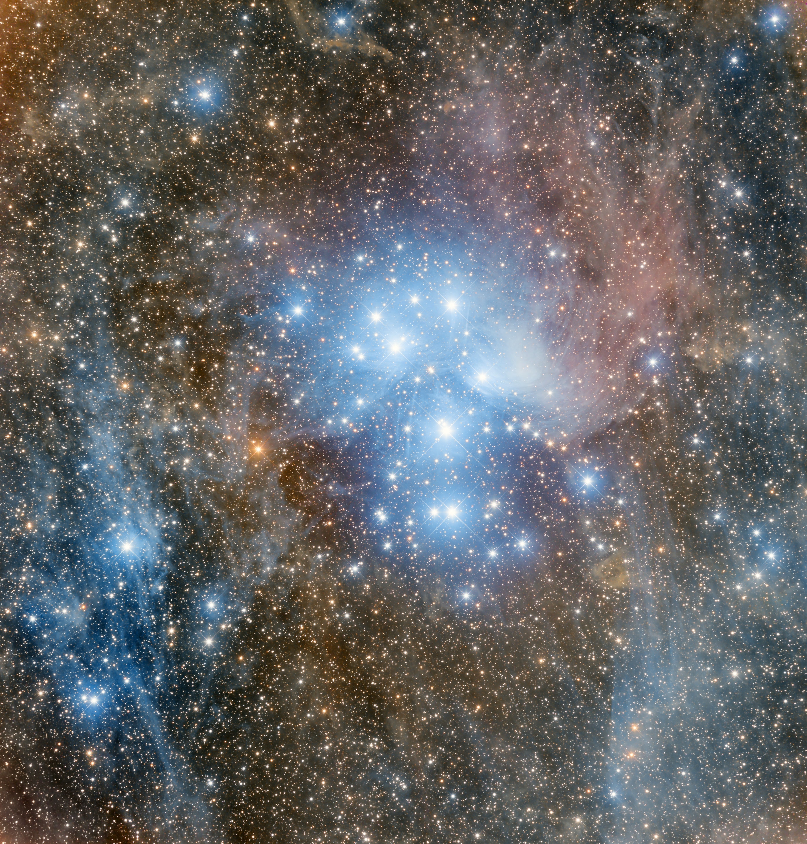 Hurtling through a cosmic dust cloud a mere 400 light-years away, the lovely Pleiades or Seven Sisters open star cluster is well-known for its striking blue reflection nebulae. It lies in the night sky toward the constellation Taurus and the Orion Arm of our Milky Way Galaxy. The sister stars and cosmic dust cloud are not related though, they just happen to be passing through the same region of space. Known since antiquity as a compact grouping of stars, Galileo first sketched the star cluster viewed through his telescope with stars too faint to be seen by eye.  Charles Messier recorded the position of the cluster as the 45th entry in his famous catalog of things which are not comets. In Greek myth, the Pleiades were seven daughters of the astronomical titan Atlas and sea-nymph Pleione. Their parents names are included in the cluster's nine brightest stars. This deep and wide telescopic image spans over 20 light-years across the Pleides star cluster.