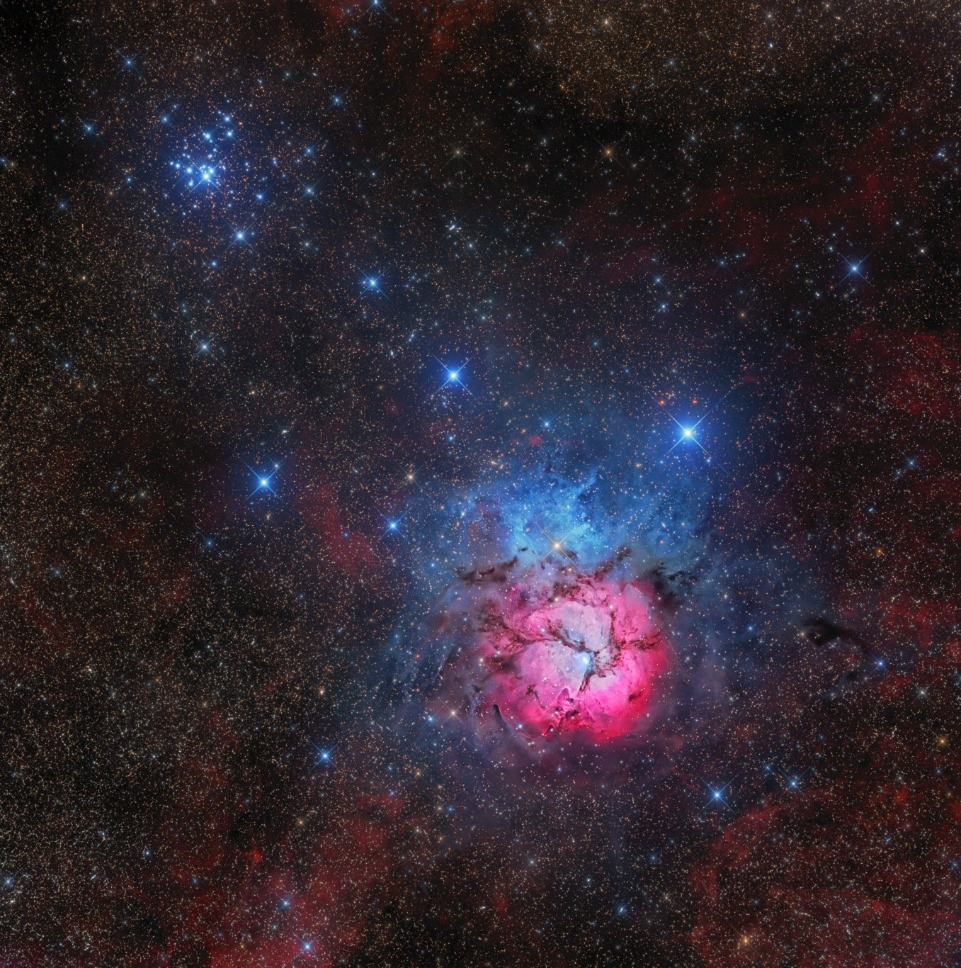 The beautiful Trifid Nebula, also known as Messier 20, is easy to find with a small telescope in the nebula rich constellation Sagittarius. About 5,000 light-years away, the colorful study in cosmic contrasts shares this well-composed, nearly 1 degree wide field with open star cluster Messier 21 (top left). Trisected by dust lanes the Trifid itself is about 40 light-years across and a mere 300,000 years old. That makes it one of the youngest star forming regions in our sky, with newborn and embryonic stars embedded in its natal dust and gas clouds. Estimates of the distance to open star cluster M21 are similar to M20's, but though they share this gorgeous telescopic skyscape there is no apparent connection between the two. In fact, M21's stars are much older, about 8 million years old.