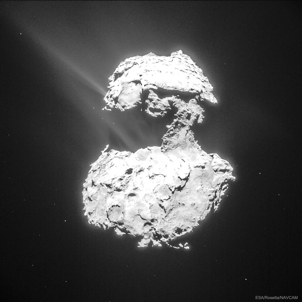 Where do comet tails come from?  There are no obvious places on the nuclei of comets from which the jets that create comet tails emanate.  One of the best images of emerging jets is shown in the featured picture, taken in 2015 by ESA's robotic Rosetta spacecraft that orbited Comet 67P/Churyumov-Gerasimenko (Comet CG) from 2014 to 2016.  The picture shows plumes of gas and dust escaping numerous places from Comet CG's nucleus as it neared the Sun and heated up.  The comet has two prominent lobes, the larger one spanning about 4 kilometers, and a smaller 2.5-kilometer lobe connected by a narrow neck. Analyses indicate that evaporation must be taking place well inside the comet's surface to create the jets of dust and ice that we see emitted through the surface.  Comet CG (also known as Comet 67P) loses in jets about a meter of radius during each of its 6.44-year orbits around the Sun, a rate at which will completely destroy the comet in only thousands of years. In 2016, Rosetta's mission ended with a controlled impact onto Comet CG's surface.   Outreach Astronomers: Future APOD writers sought.
