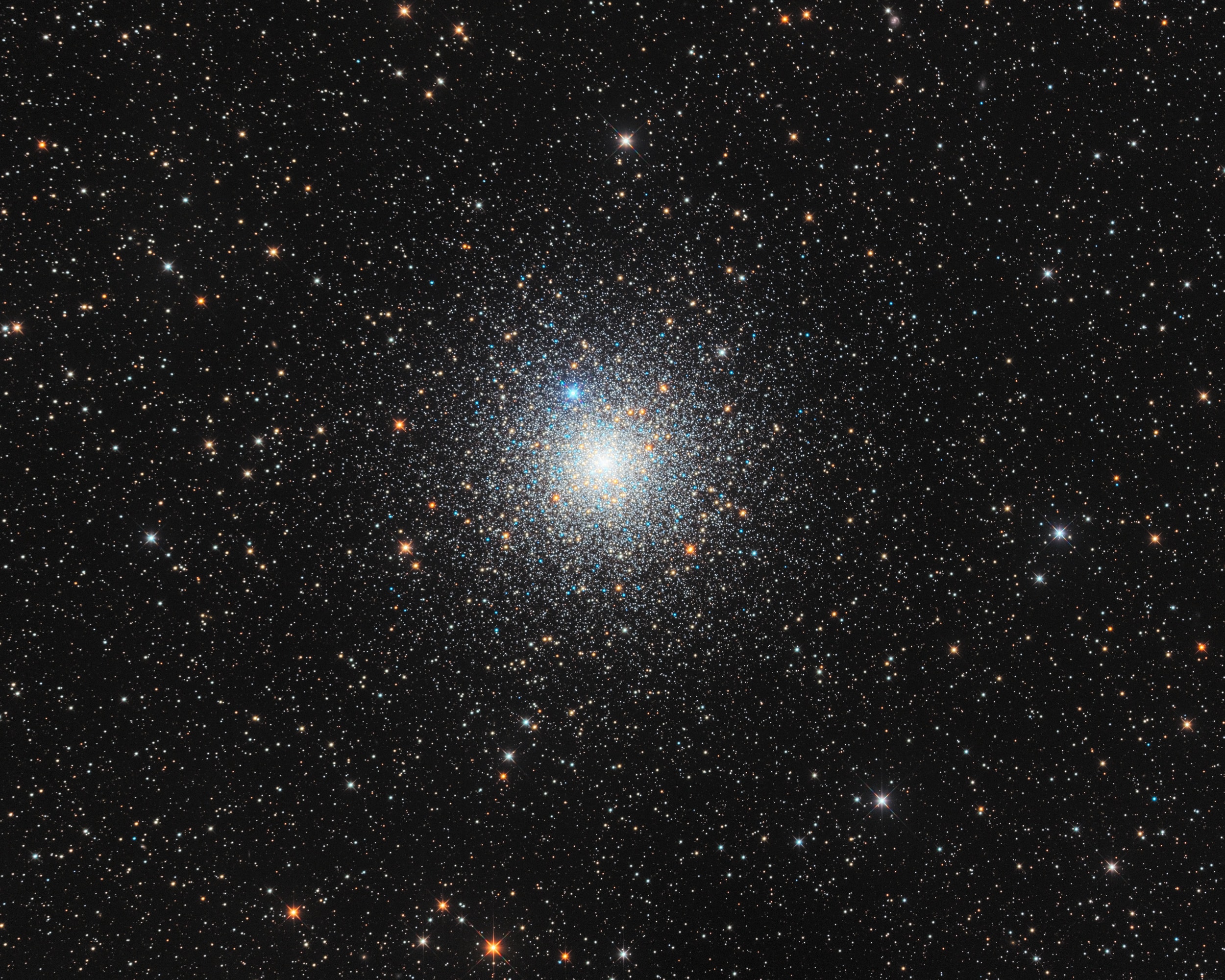 Some 13,000 light-years away toward the southern constellation Pavo, the globular star cluster NGC 6752 roams the halo of our Milky Way galaxy. Over 10 billion years old, NGC 6752 follows clusters Omega Centauri and 47 Tucanae as the third brightest globular in planet Earth's night sky. It holds over 100 thousand stars in a sphere about 100 light-years in diameter. Telescopic explorations of the NGC 6752 have found that a remarkable fraction of the stars near the cluster's core, are multiple star systems. They also reveal the presence of blue straggle stars, stars which appear to be too young and massive to exist in a cluster whose stars are all expected to be at least twice as old as the Sun. The blue stragglers are thought to be formed by star mergers and collisions in the dense stellar environment at the cluster's core. This sharp color composite also features the cluster's ancient red giant stars in yellowish hues. (Note: The bright, spiky blue star at 11 o'clock from the cluster center is a foreground star along the line-of-sight to NGC 6752)