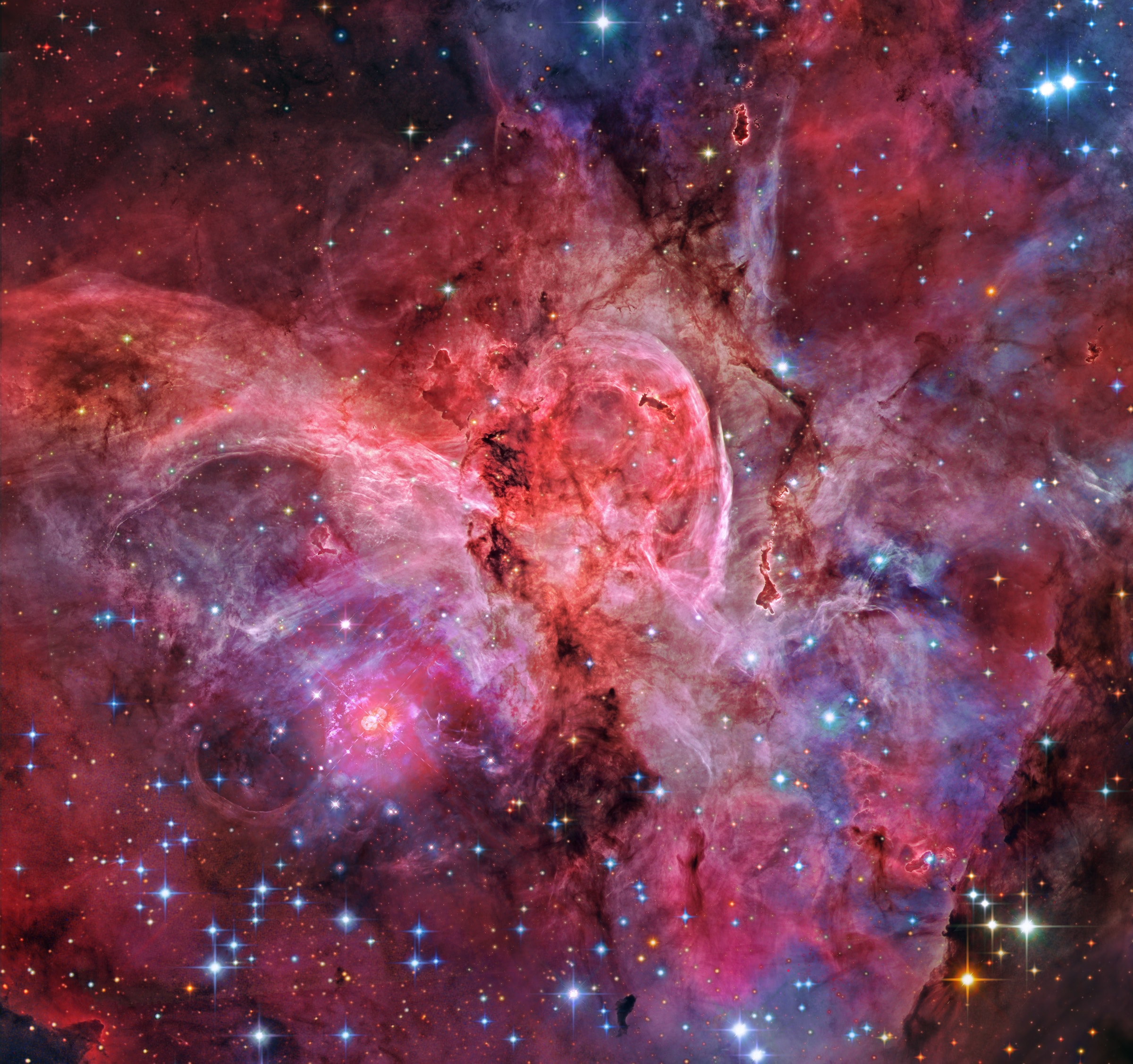 A jewel of the southern sky, the Great Carina Nebula, also known as NGC 3372, spans over 300 light-years, one of our galaxy's largest star forming regions. Like the smaller, more northerly Great Orion Nebula, the Carina Nebula is easily visible to the unaided eye, though at a distance of 7,500 light-years it is some 5 times farther away. This gorgeous telescopic close-up reveals remarkable details of the region's central glowing filaments of interstellar gas and obscuring cosmic dust clouds in a field of view nearly 20 light-years across. The Carina Nebula is home to young, extremely massive stars, including the still enigmatic and violently variable Eta Carinae, a star system with well over 100 times the mass of the Sun. In the processed composite of space and ground-based image data a dusty, two-lobed Homunculus Nebula appears to surround Eta Carinae itself just below and left of center. While Eta Carinae is likely on the verge of a supernova explosion, X-ray images indicate that the Great Carina Nebula has been a veritable supernova factory.