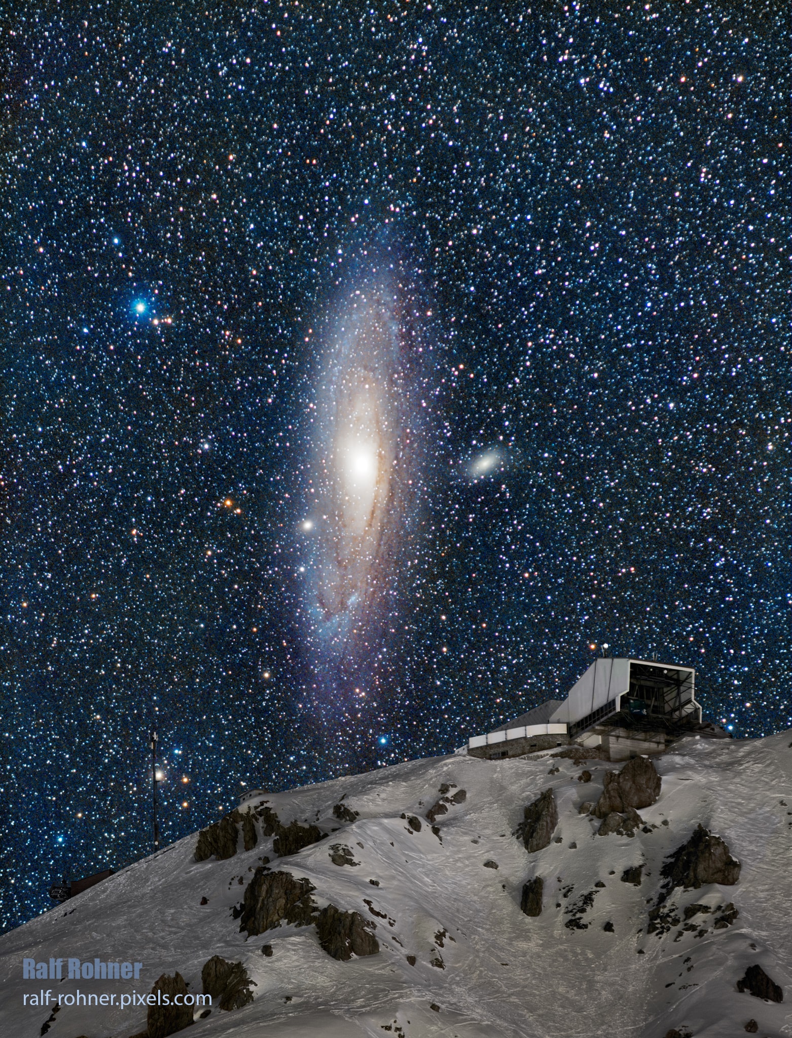 This surreal picture isn't from a special effects sci-fi movie. It is a digital composite of frames of the real Andromeda Galaxy, also known as M31, rising over a real mountain. Exposures tracking the galaxy and background stars have been digitally combined with separate exposures of the foreground terrain. All background and foreground exposures were made back to back with the same camera and telephoto lens on the same night from the same location. In the "Deepscape" combination they produce a stunning image that reveals a range of brightness and color that your eye can't quite see on its own. Still, it does look like you could ride a cable car up this mountain and get off at the station right next to Andromeda. But at 2.5 million light-years from Earth the big beautiful spiral galaxy really is a little out of reach as a destination. Don't worry, though. Just wait 5 billion years and the Andromeda Galaxy will come to you. This Andromeda Station is better known as Weisshorn, the highest peak of the ski area in Arosa, Switzerland.