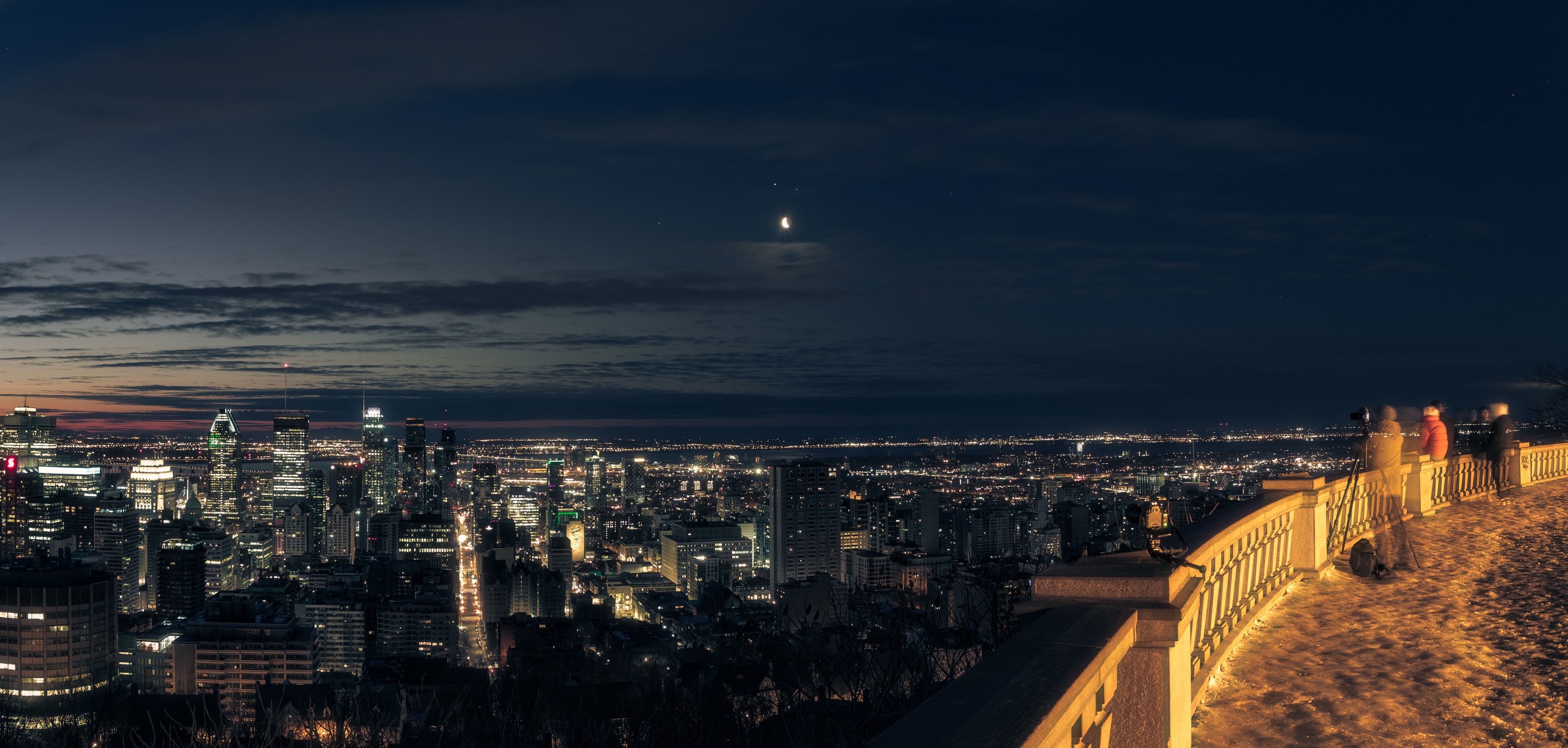 Dawn's early light came to Montreal, northern planet Earth, on March 18, the day before the vernal equinox. At the end of that nearly equal night the Moon stands above a dense constellation of urban lights in this serene city and skyscape. Of course the Moon's waning crescent faces toward the rising Sun. Skygazers could easily spot bright Jupiter just above the Moon, close on the sky to a fainter Mars. Saturn, a telescopic favorite, is just a pinprick of light below and farther left of the closer conjunction of Moon, Jupiter and Mars. Near the ecliptic, even Mercury is rising along a line extended to the horizon from Jupiter and Saturn. The elusive inner planet is very close to the horizon though, and not quite visible in this morning's sky.