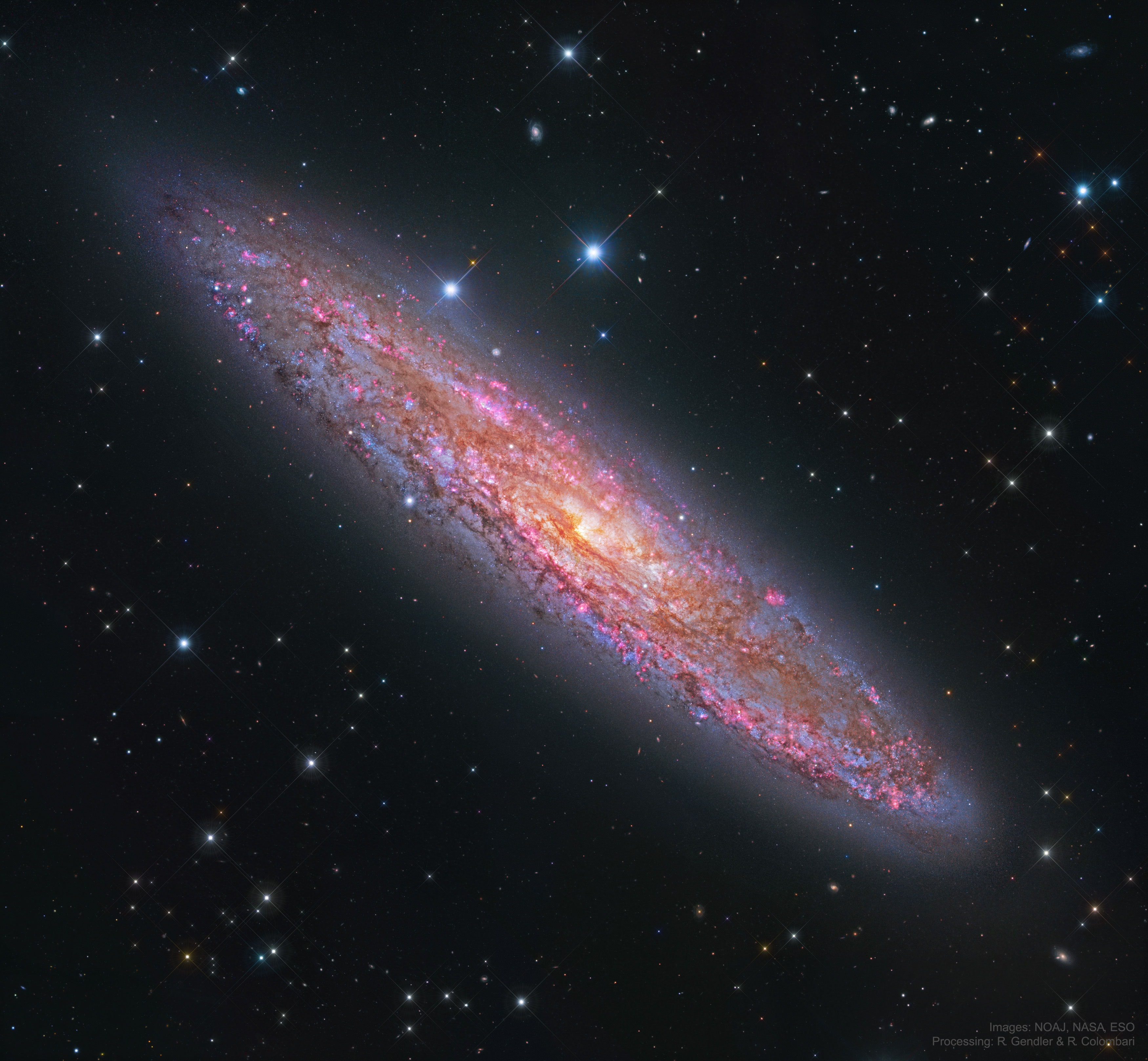 NGC 253 is one of the brightest spiral galaxies visible, but also one of the dustiest.  Dubbed the Silver Coin for its appearance in smalltelescopes, it is more formally known as the Sculptor Galaxy for its location within the boundaries of the southern constellation Sculptor.  Discovered in 1783 by mathematician and astronomer Caroline Herschel, the dusty island universe lies a mere 10 million light-years away. About 70 thousand light-years across, NGC 253, pictured, is the largest member of the Sculptor Group of Galaxies, the nearest to our own Local Group of galaxies.  In addition to its spiral dust lanes, tendrils of dust seem to be rising from a galactic disk laced with young star clusters and star forming regions in this sharp color image. The high dust content accompanies frantic star formation, earning NGC 253 the designation of a starburst galaxy. NGC 253 is also known to be a strong source of high-energy x-rays and gamma rays, likely due to massive black holes near the galaxy's center. Take a trip through extragalactic space in this short video flyby of NGC 253.   Astrophysicists: Browse 2,100+ codes in the Astrophysics Source Code Library