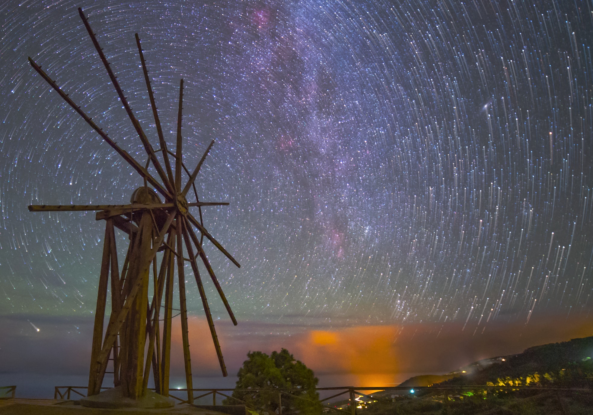 Stars can't turn these old wooden arms, but it does look like they might in this scene from a rotating planet. The well-composed night skyscape was recorded from Garafia, a municipality on the island of La Palma, Canary Islands, planet Earth. The center of the once working windmill, retired since 1953, is lined-up with the north celestial pole, the planet's rotation axis projected on to the northern sky. From a camera fixed to a tripod, the star trails are a reflection of the planet's rotation traced in a digital composite of 39 sequential exposures each 25 seconds long. Brought out by highlighting the final exposure in the sequence, the stars themselves appear at the ends of their short concentric arcs. A faint band of winter's Milky Way and even a diffuse glow from our neighboring Andromeda Galaxy also shine in the night.