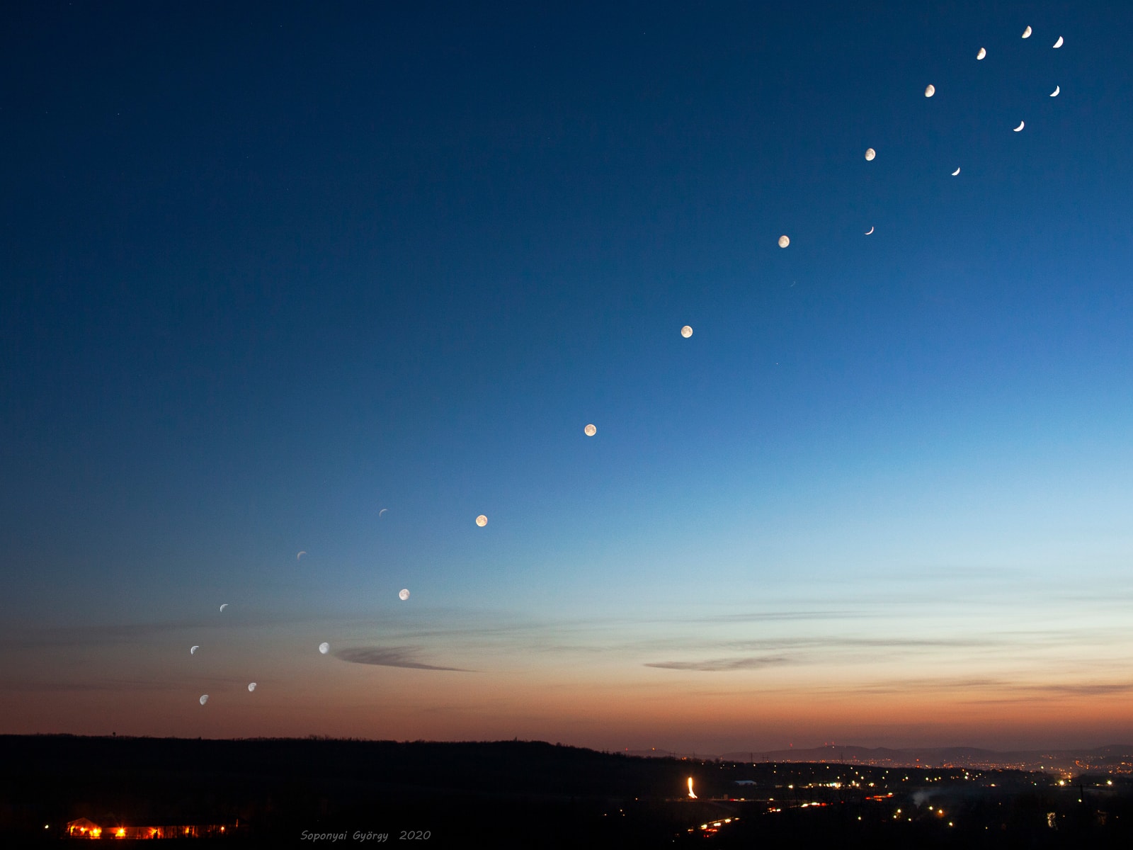 An analemma is that figure-8 curve you get when you mark the position of the Sun at the same time each day for one year. But the trick to imaging an analemma of the Moon is to wait bit longer. On average the Moon returns to the same position in the sky about 50 minutes and 29 seconds later each day. So photograph the Moon 50 minutes 29 seconds later on successive days. Over one lunation or lunar month it will trace out an analemma-like curve as the Moon's actual position wanders due to its tilted and elliptical orbit. To create this composite image of a lunar analemma, astronomer Gyorgy Soponyai chose a lunar month from March 26 to April 18 with a good stretch of weather and a site close to home near Mogyorod, Hungary. Crescent lunar phases too thin and faint to capture around the New Moon are missing though. Facing southwest, the lights of Budapest are in the distance of the base image taken on March 27.