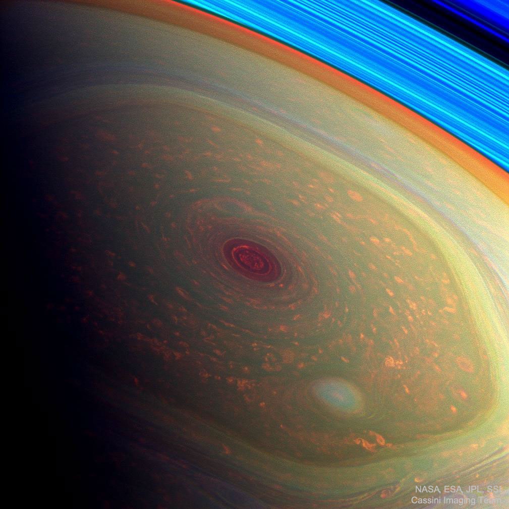 Why would clouds form a hexagon on Saturn? Nobody is sure.   Originally discovered during the Voyager flybys of Saturn in the 1980s, nobody has ever seen anything like it anywhere else in the Solar System.  Acquiring its first sunlit views of far northern Saturn in late 2012, the Cassini spacecraft's wide-angle camera recorded this stunning, false-color image of the ringed planet's north pole. The composite of near-infrared image data results in red hues for low clouds and green for high ones, giving the Saturnian cloudscape a vivid appearance. This and similar images show the stability of the hexagon even 20+ years after Voyager.  Movies of Saturn's North Pole show the cloud structure maintaining its hexagonal structure while rotating.  Unlike individual clouds appearing like a hexagon on Earth, the Saturn cloud pattern appears to have six well defined sides of nearly equal length. Four Earths could fit inside the hexagon. Beyond the cloud tops at the upper right, arcs of the planet's eye-catching rings appear bright blue.