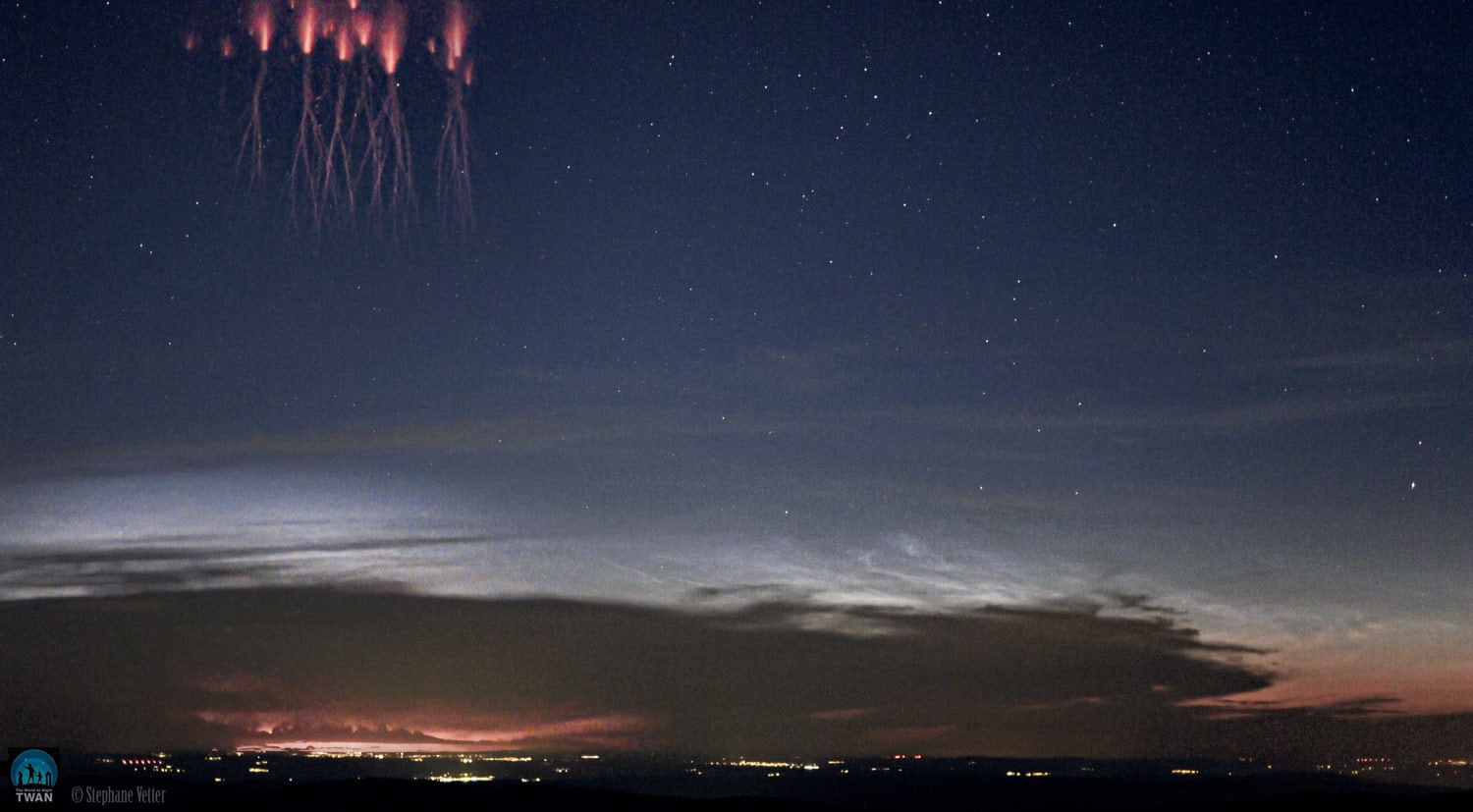A sensitive video camera on a summit of the Vosges mountains in France captured these surprising fireworks above a distant horizon on June 26. Generated over intense thunderstorms, this one about 260 kilometers away, the brief and mysterious flashes have come to be known as red sprites. The transient luminous events are caused by electrical breakdown at altitudes of 50 to 100 kilometers. That puts them in the mesophere, the coldest layer of planet Earth's atmosphere. The glow beneath the sprites is from more familiar lighting though, below the storm clouds. But on the right, the video frames have captured another summertime apparition from the mesophere. The silvery veins of light are polar mesospheric clouds. Also known as noctilucent or night shining clouds, the icy clouds still reflect the sunlight when the Sun is below the horizon.