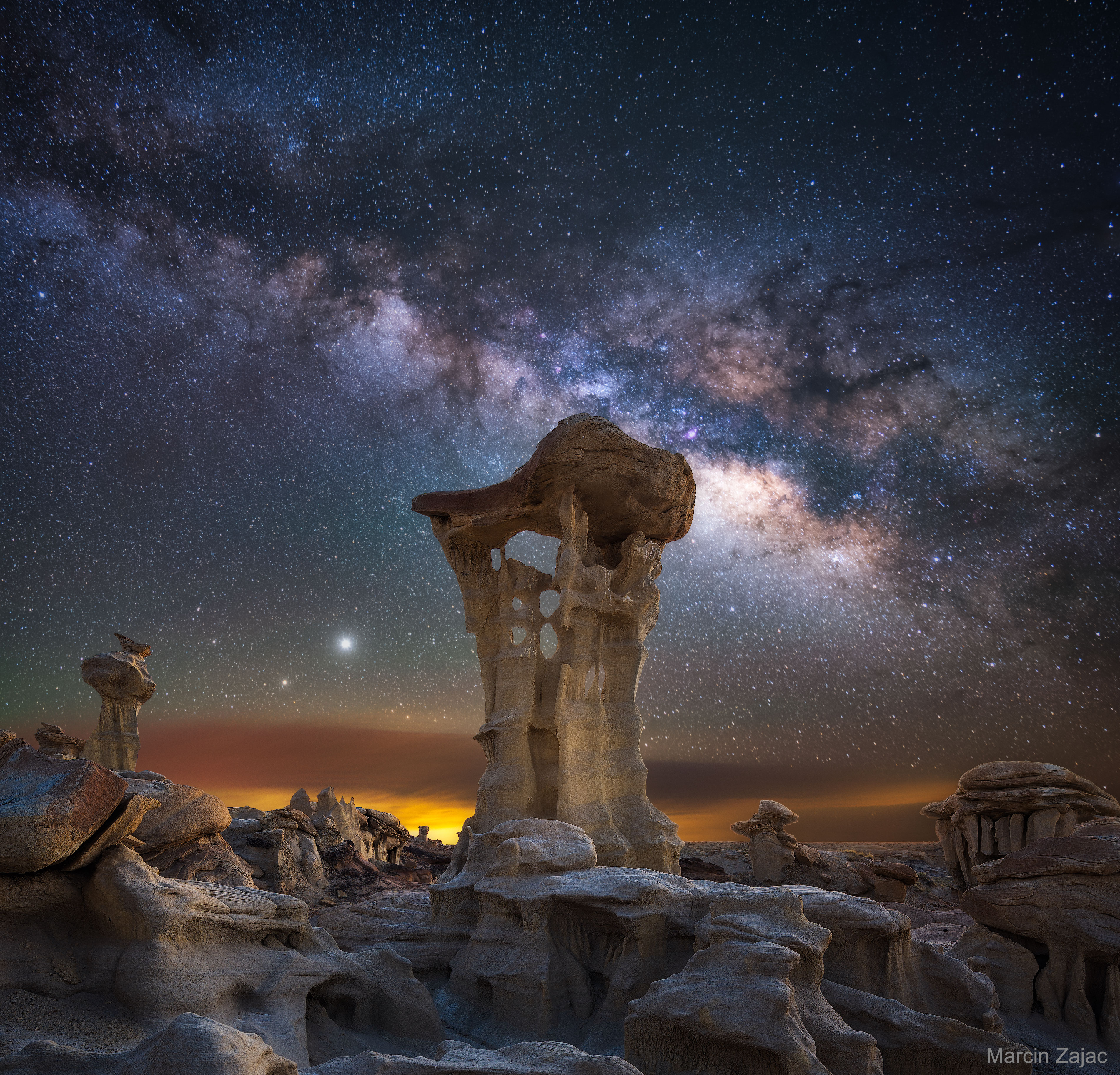 What planets are those behind that unusual rock spire? Saturn (lower left) and Jupiter.  This month, after sunset, the bright planetary duo are quite prominent toward the southeast.  Now your view of our Solar System's largest planets might not include a picturesque hoodoo in the foreground, nor the spectacular central band of our Milky Way Galaxy across the background, but should be quite eye-catching anyway.  The featured image is a composite of consecutive foreground and background exposures all taken in late May with the same camera and from the same location -- the badlands of the  Ah-Shi-Sle-Pah Wilderness in the San Juan Basin in New Mexico, USA.  The rock spire, informally dubbed 'Alien Throne', stands about 3 meters tall. Saturn and Jupiter will remain visible together after sunset for several months.