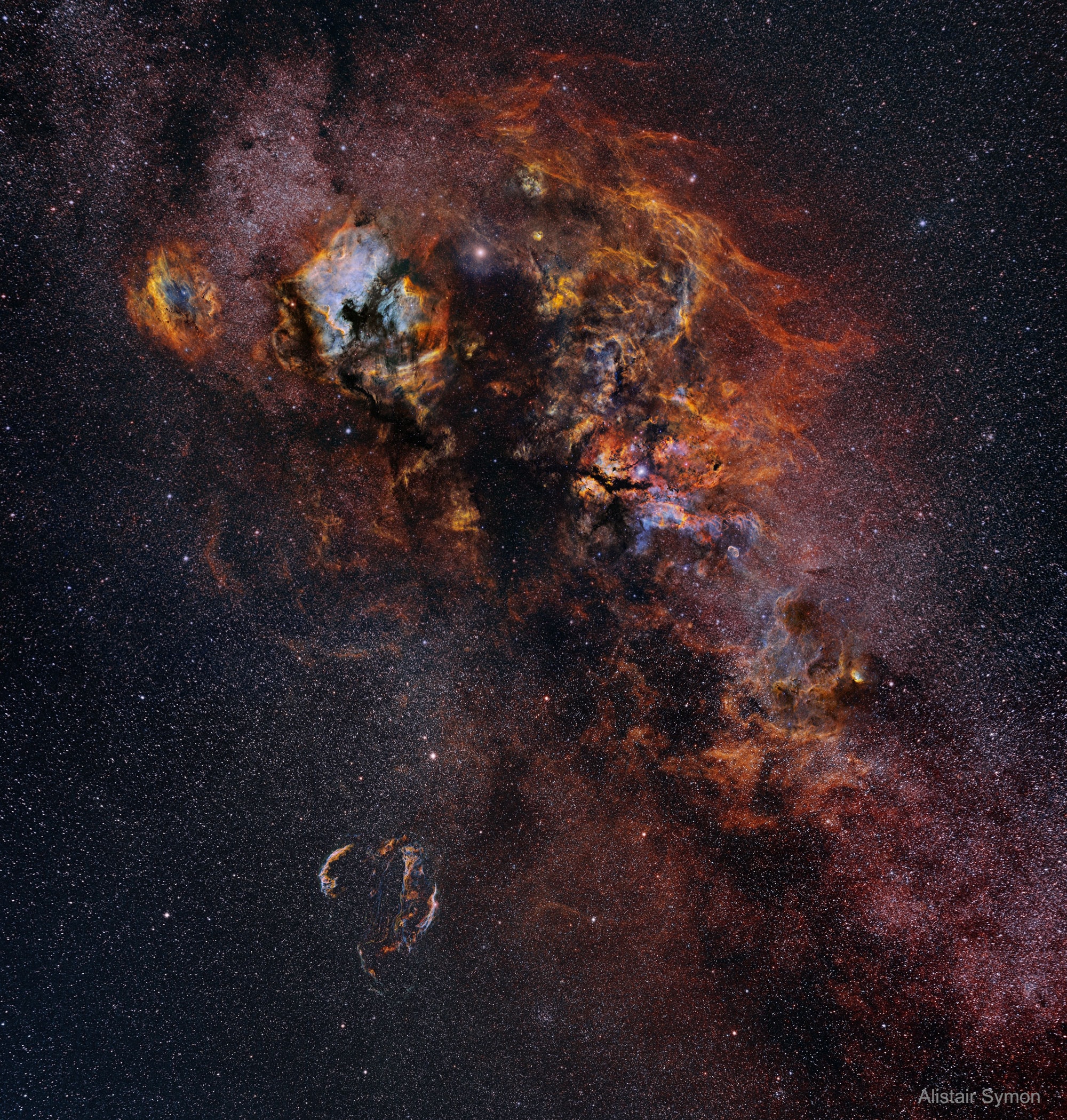 In brush strokes of interstellar dust and glowing hydrogen gas, this beautiful skyscape is painted across the plane of our Milky Way Galaxy near the northern end of the Great Rift and the constellation Cygnus the Swan. Composed using 22 different images and over 180 hours of image data, the widefield mosaic spans an impressive 24 degrees across the sky. Alpha star of Cygnus, bright, hot, supergiant Deneb lies near top center. Crowded with stars and luminous gas clouds Cygnus is also home to the dark, obscuring Northern Coal Sack Nebula, extending from Deneb toward the center of the view. The reddish glow of star forming regions NGC 7000 and IC 5070, the North America Nebula and Pelican Nebulas, are just left of Deneb. The Veil Nebula is a standout below and left of center. A supernova remnant, the Veil is some 1,400 light years away, but many other nebulae and star clusters are identifiable throughout the cosmic scene. Of course, Deneb itself is also known to northern hemisphere skygazers for its place in two asterisms -- marking the top of the Northern Cross and a vertex of the Summer Triangle.   Follow APOD on: Instagram, Facebook,  Reddit, or Twitter