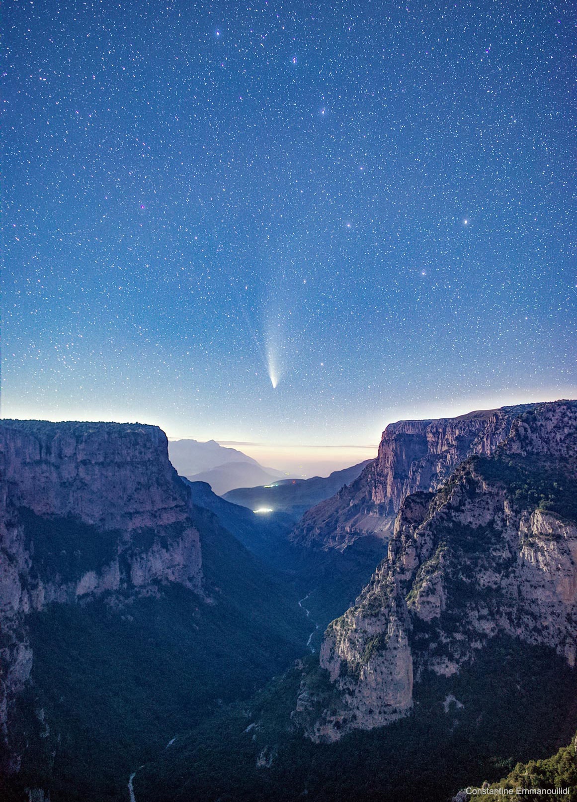 Did the Earth part to show us this comet?  Of course not, even if this image makes it seem that way. Pictured far in the background is Comet NEOWISE as it appeared about two weeks ago over northern Greece. Above the comet are many stars including the bright stars of the Big Dipper (also the Sorcerer, in Aztec mythology), an asterism that many people around the world used to find the naked-eye comet as it hovered in the northern sky over the past month.  In the foreground is Vikos Gorge, the deepest gorge on Earth, relative to its width. The gorge was slowly created by erosion from the Voidomatis River over the past few million years.  Capturing this image took a lot of planning, waiting, luck, braving high winds, and avoiding local wolves.  Comet C/2020 F3 (NEOWISE) continues to fade and is now best visible through binoculars as it coasts back to the outer Solar System.    Notable Comet NEOWISE Images: July 31 30, 29, 28, 27, 26, 25, 24