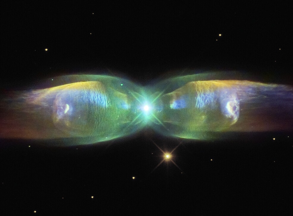 Are stars better appreciated for their art after they die?  Actually, stars usually create their most artistic displays as they die.  In the case of low-mass stars like our Sun and M2-9 pictured here, the stars transform themselves from normal stars to white dwarfs by casting off their outer gaseous envelopes.  The expended gas frequently forms an impressive display called a planetary nebula that fades gradually over thousands of years.  M2-9, a butterfly planetary nebula 2100 light-years away shown in representative colors, has wings that tell a strange but incomplete tale.  In the center, two stars orbit inside a gaseous disk 10 times the orbit of Pluto.  The expelled envelope of the dying star breaks out from the disk creating the bipolar appearance.  Much remains unknown about the physical processes that cause and shape planetary nebulae.   Almost Hyperspace: Random APOD Generator