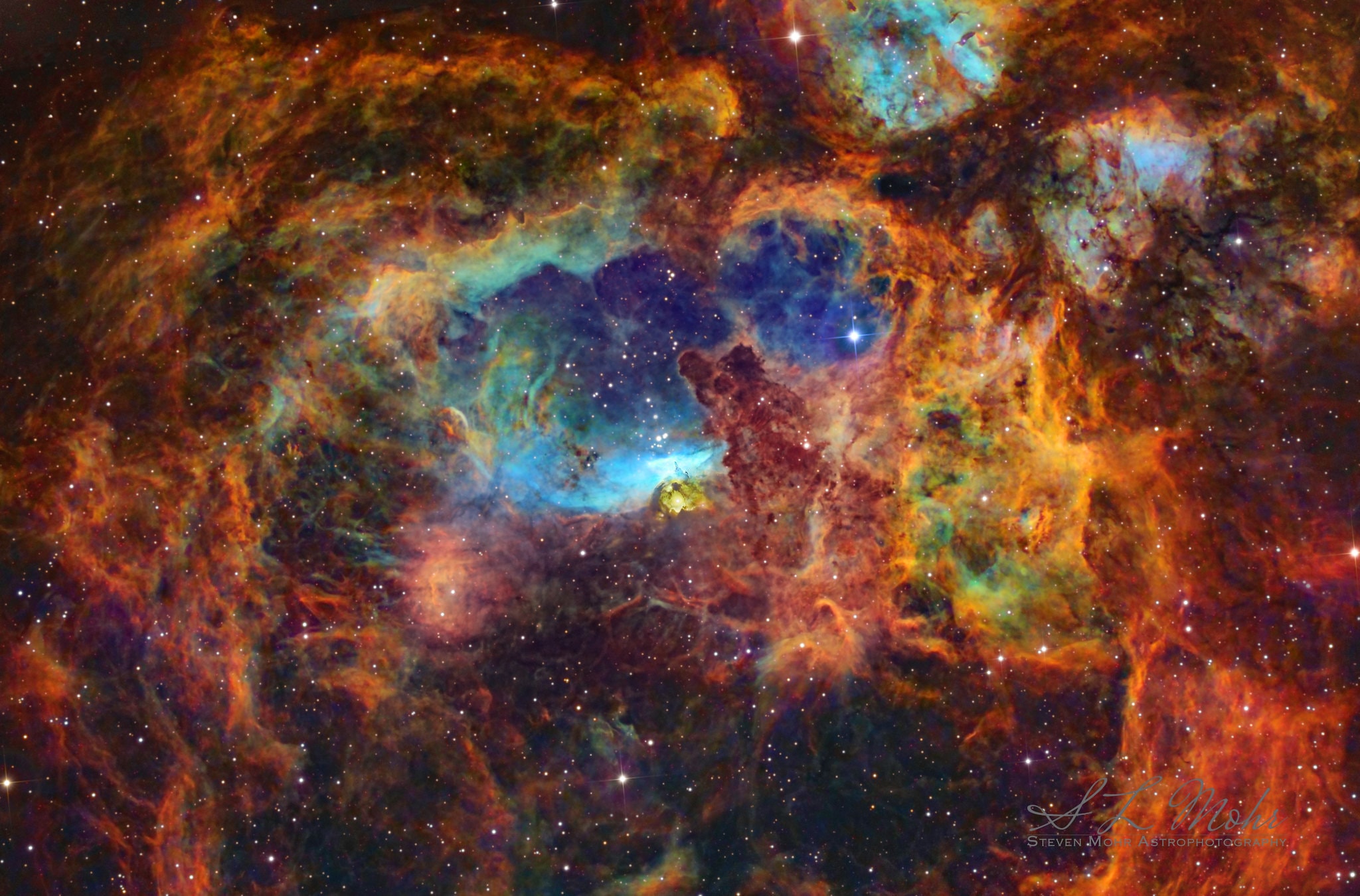 Why is the Lobster Nebula forming some of the most massive stars known? No one is yet sure.  Cataloged as NGC 6357, the Lobster Nebula houses the open star cluster Pismis 24 near its center -- a home to unusually bright and massive stars.  The overall blue glow near the inner star forming region results from the emission of ionized hydrogen gas.   The surrounding nebula, featured here, holds a complex tapestry of gas, dark dust, stars still forming, and newly born stars.  The intricate patterns are caused by complex interactions between interstellar winds, radiation pressures, magnetic fields, and gravity.  NGC 6357 spans about 400 light years and lies about 8,000 light years away toward the constellation of the Scorpion.