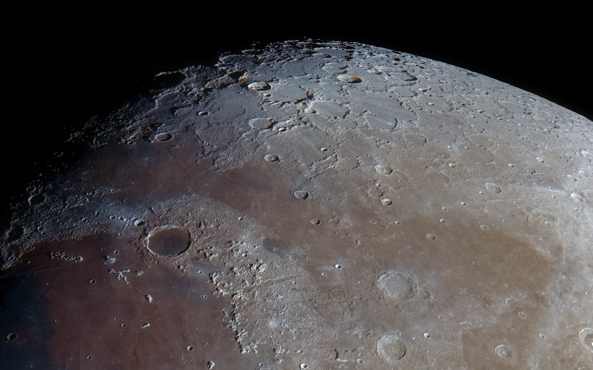 Lighter than typically dark, smooth, mare the Mare Frigoris lies in the far lunar north. Also known as the Sea of Cold, it stretches across the familiar lunar nearside in this close up of the waxing gibbous Moon's north polar region. Dark-floored, 95 kilometer wide crater Plato is just left of the center. Sunlit peaks of the lunar Alps (Montes Alpes) are highlighted below and right of Plato, between the more southern Mare Imbrium (Sea of Rains) and Mare Frigoris. The prominent straight feature cutting through the mountains is the lunar Alpine Valley (Vallis Alpes). Joining the Mare Imbrium and Mare Frigoris, the lunar valley is about 160 kilometers long and up to 10 kilometers wide.