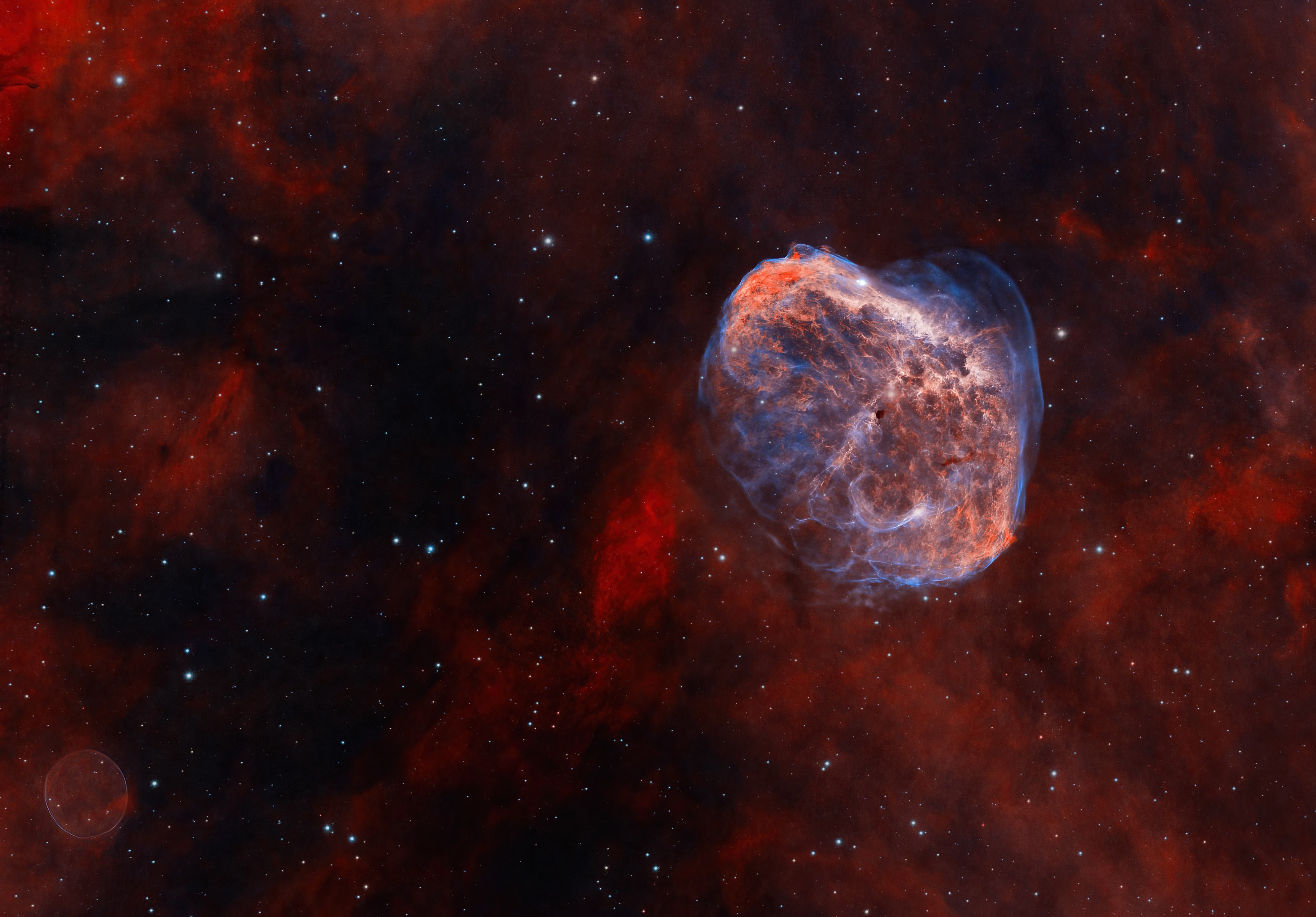 These clouds of gas and dust drift through rich star fields along the plane of our Milky Way Galaxy toward the high flying constellation Cygnus. Caught within the telescopic field of view are the Soap Bubble (lower left) and the Crescent Nebula (upper right). Both were formed at a final phase in the life of a star. Also known as NGC 6888, the Crescent was shaped as its bright, central massive Wolf-Rayet star, WR 136, shed its outer envelope in a strong stellar wind. Burning through fuel at a prodigious rate, WR 136 is near the end of a short life that should finish in a spectacular supernova explosion.  Discovered in 2013, the Soap Bubble Nebula is likely a planetary nebula, the final shroud of a lower mass, long-lived, sun-like star destined to become a slowly cooling white dwarf. Both stellar shrouds are 5,000 light-years or so distant. The larger Crescent Nebula is around 25 light-years across.