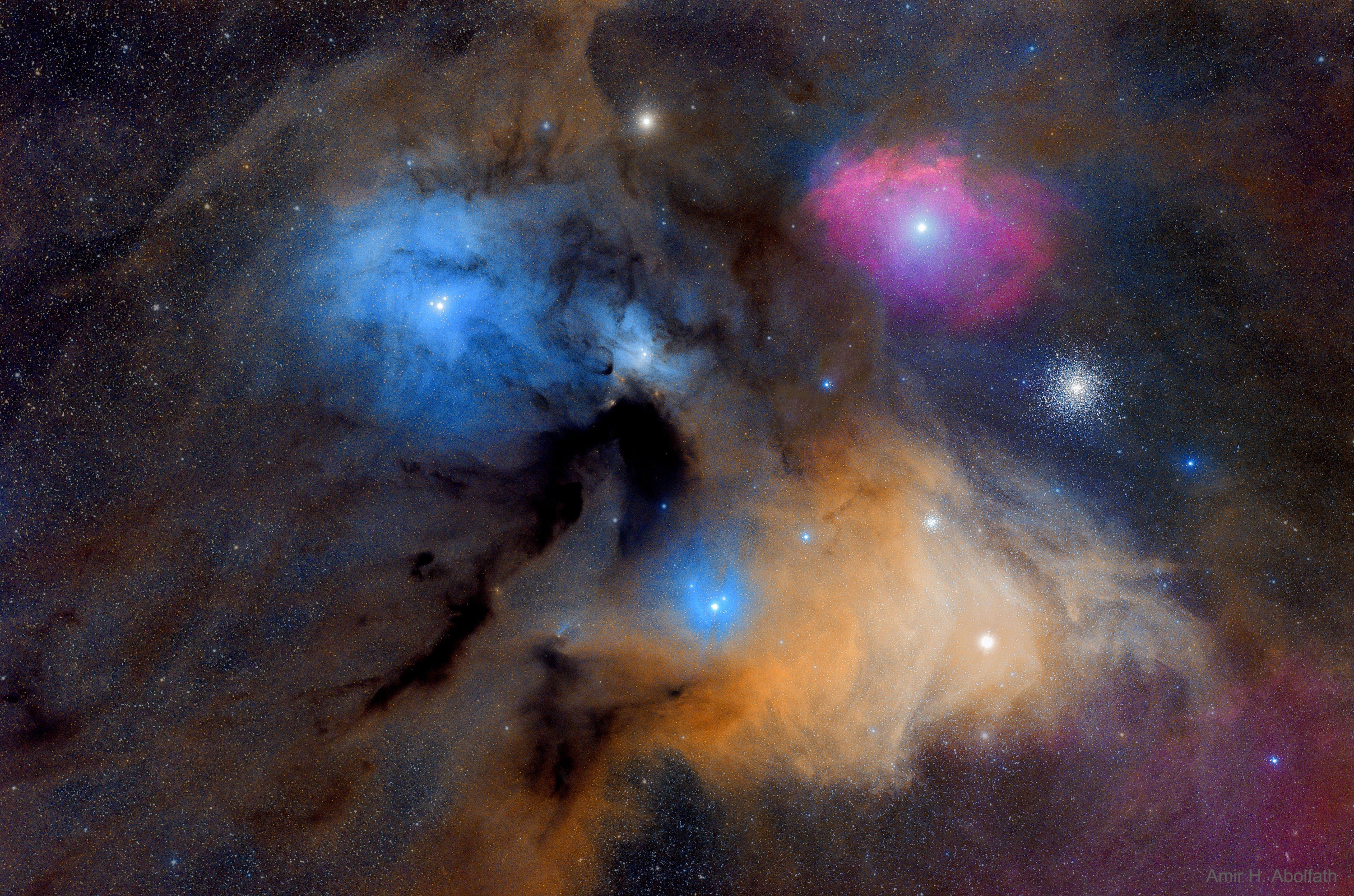 The many spectacular colors of the Rho Ophiuchi (oh'-fee-yu-kee) clouds highlight the many processes that occur there.  The blue regions shine primarily by reflected light.  Blue light from the  Rho Ophiuchi star system and nearby stars reflects more efficiently off this portion of the nebula than red light.  The Earth's daytime sky appears blue for the same reason.  The red and yellow regions shine primarily because of emission from the nebula's atomic and molecular gas.  Light from nearby blue stars - more energetic than the bright star  Antares - knocks electrons away from the gas, which then shines when the electrons recombine with the gas.  The dark brown regions are caused by dust grains - born in young stellar atmospheres - which effectively block light emitted behind them.  The Rho Ophiuchi star clouds, well in front of the globular cluster M4 visible here on the upper right, are even more colorful than humans can see - the clouds emits light in every wavelength band from the radio to the gamma-ray.   Astrophysicists: Browse 2,200+ codes in the Astrophysics Source Code Library
