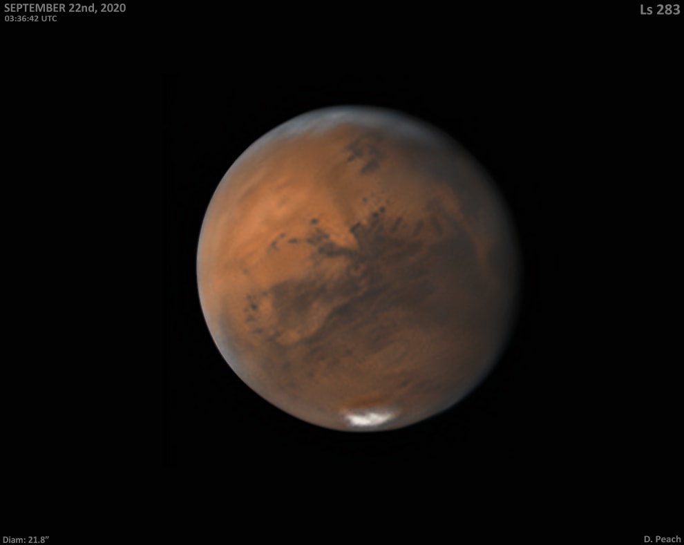 As telescopes around planet Earth watch, Mars is growing brighter in night skies, approaching its 2020 opposition on October 13. Mars looks like it's watching too in this view of the Red Planet from September 22. Mars' disk is already near its maximum apparent size for earthbound telescopes, less than 1/80th the apparent diameter of a Full Moon. The seasonally shrinking south polar cap is at the bottom and hazy northern clouds are at the top. A circular, dark albedo feature, Solis Lacus (Lake of the Sun), is just below and left of disk center. Surrounded by a light area south of Valles Marineris, Solis Lacus looks like a planet-sized pupil, famously known as The Eye of Mars . Near the turn of the 20th century, astronomer and avid Mars watcher Percival Lowell associated the Eye of Mars with a conjunction of canals he charted in his drawings of the Red Planet. Broad, visible changes in the size and shape of the Eye of Mars are now understood from high resolution surface images to be due to dust transported by winds in the thin Martian atmosphere.